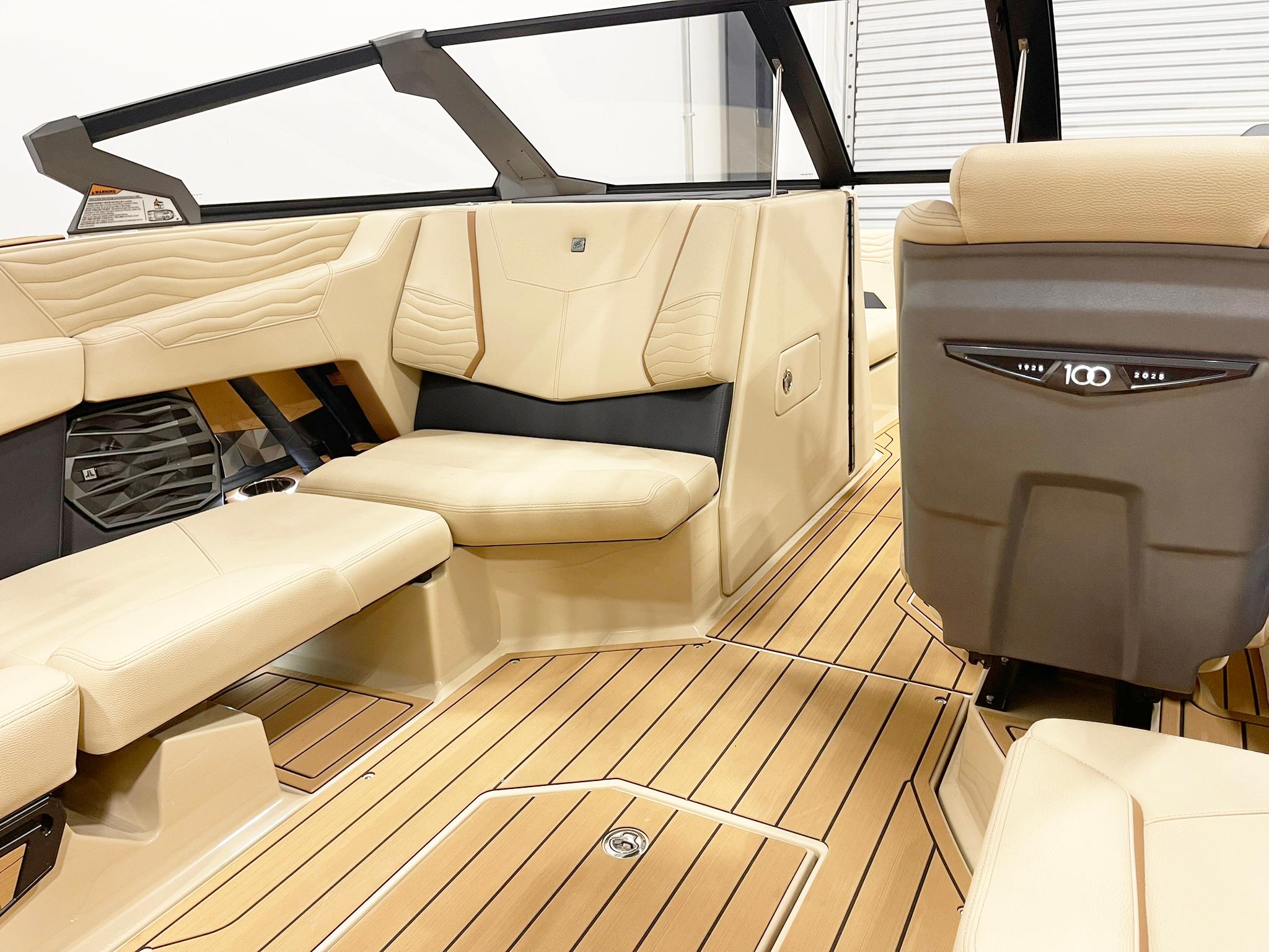 2025 Nautique Super Air Nautique G25 interior with beige seating and sleek design.