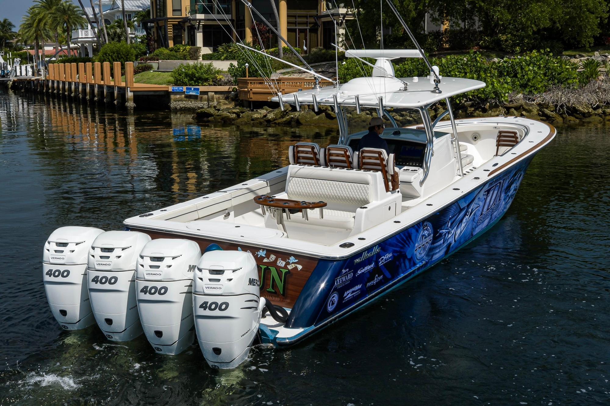 2020 Valhalla Boatworks V-41 with quad 400 engines cruising in a scenic waterway.
