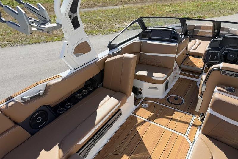 Luxurious interior of 2026 Supra SL boat with tan seating and sleek design.