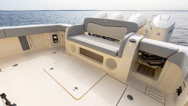 2025 Scout 425 LXF boat interior with seating and outboard motors on open water.