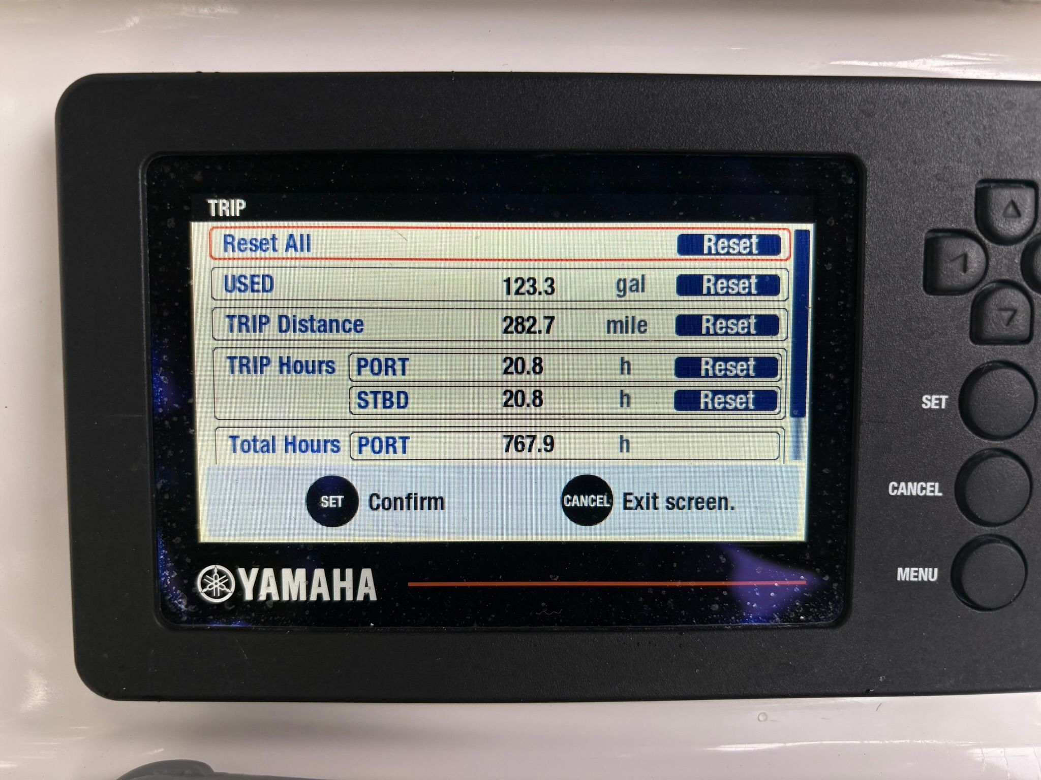 A Yamaha display shows boat data like fuel usage and trip hours.
