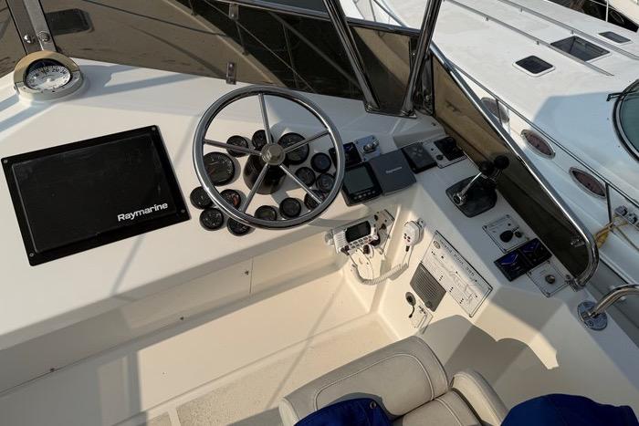 2007 Island Pilot 395 helm with steering wheel and navigation equipment.
