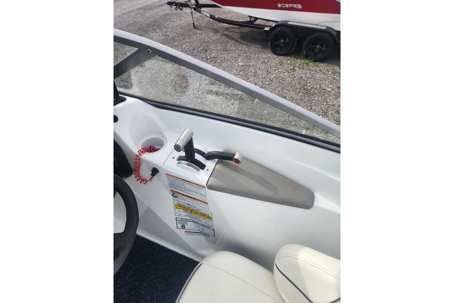 Interior view of a 2012 Sea-Doo Sport Boats 180 Challenger, showcasing throttle controls and seating.