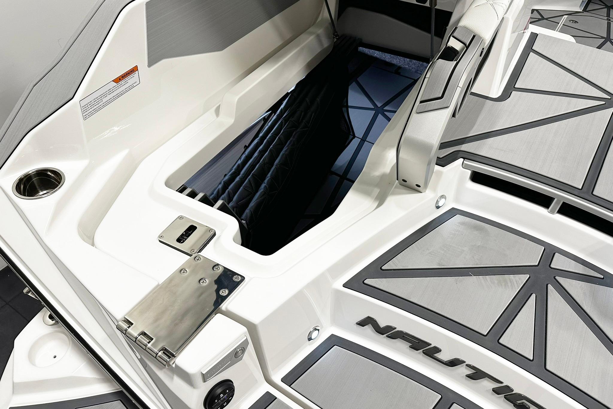 2025 Nautique Super Air Nautique G23 Paragon boat interior with storage compartment.