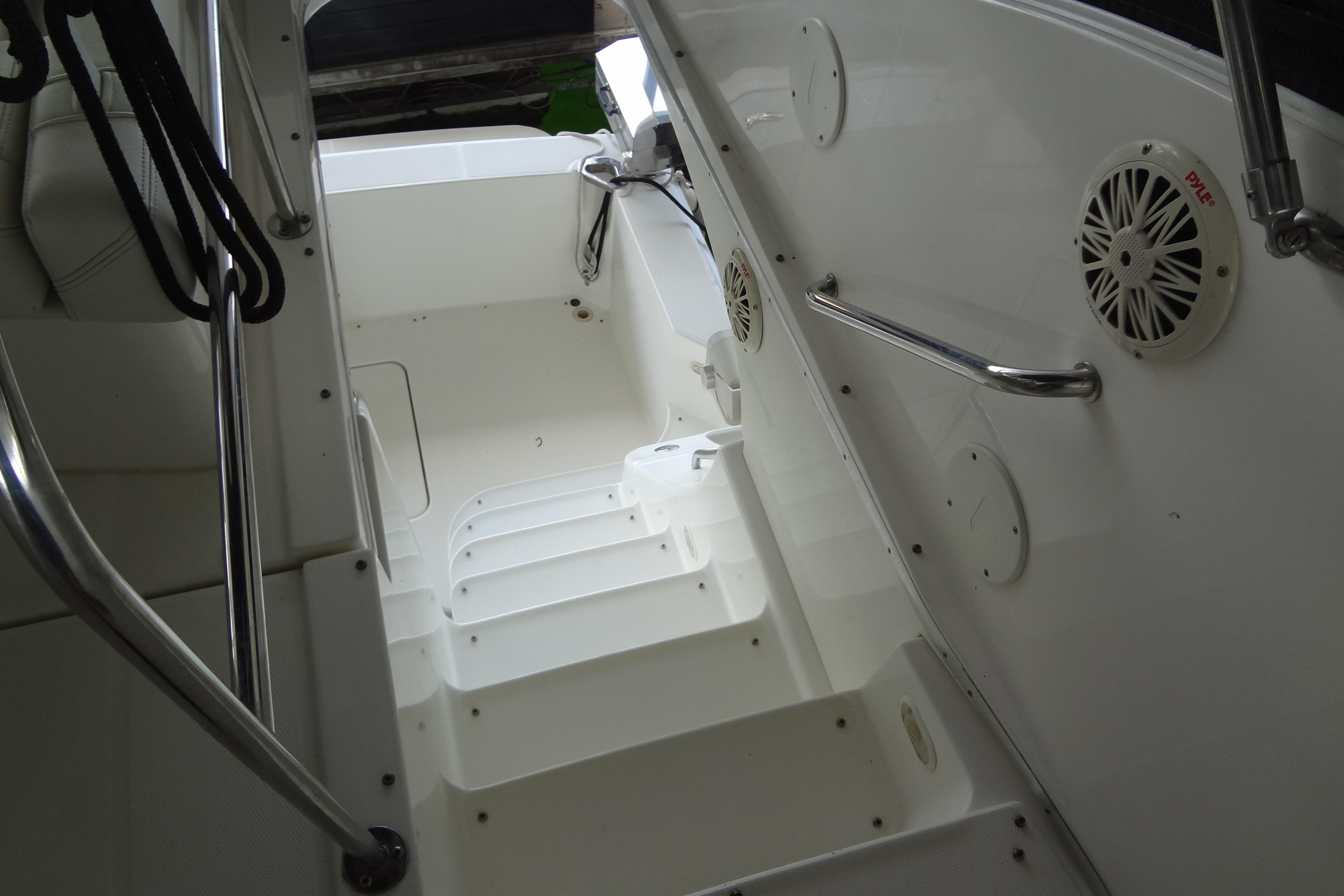 2005 Silverton 34 Convertible boat interior with white steps and stainless steel railings.