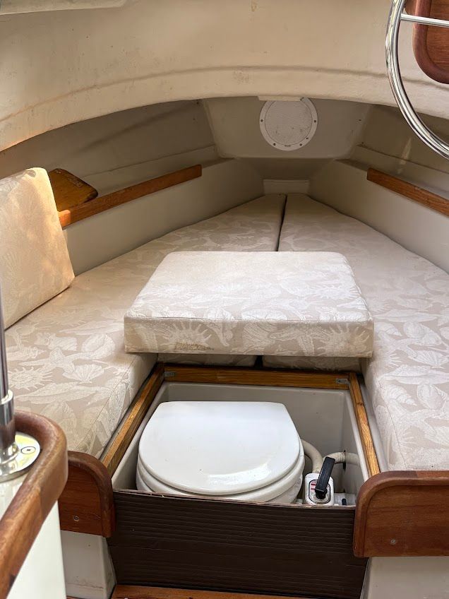 Interior of a 2007 Ranger Tugs R-21 EC featuring a sleeping area and a toilet.