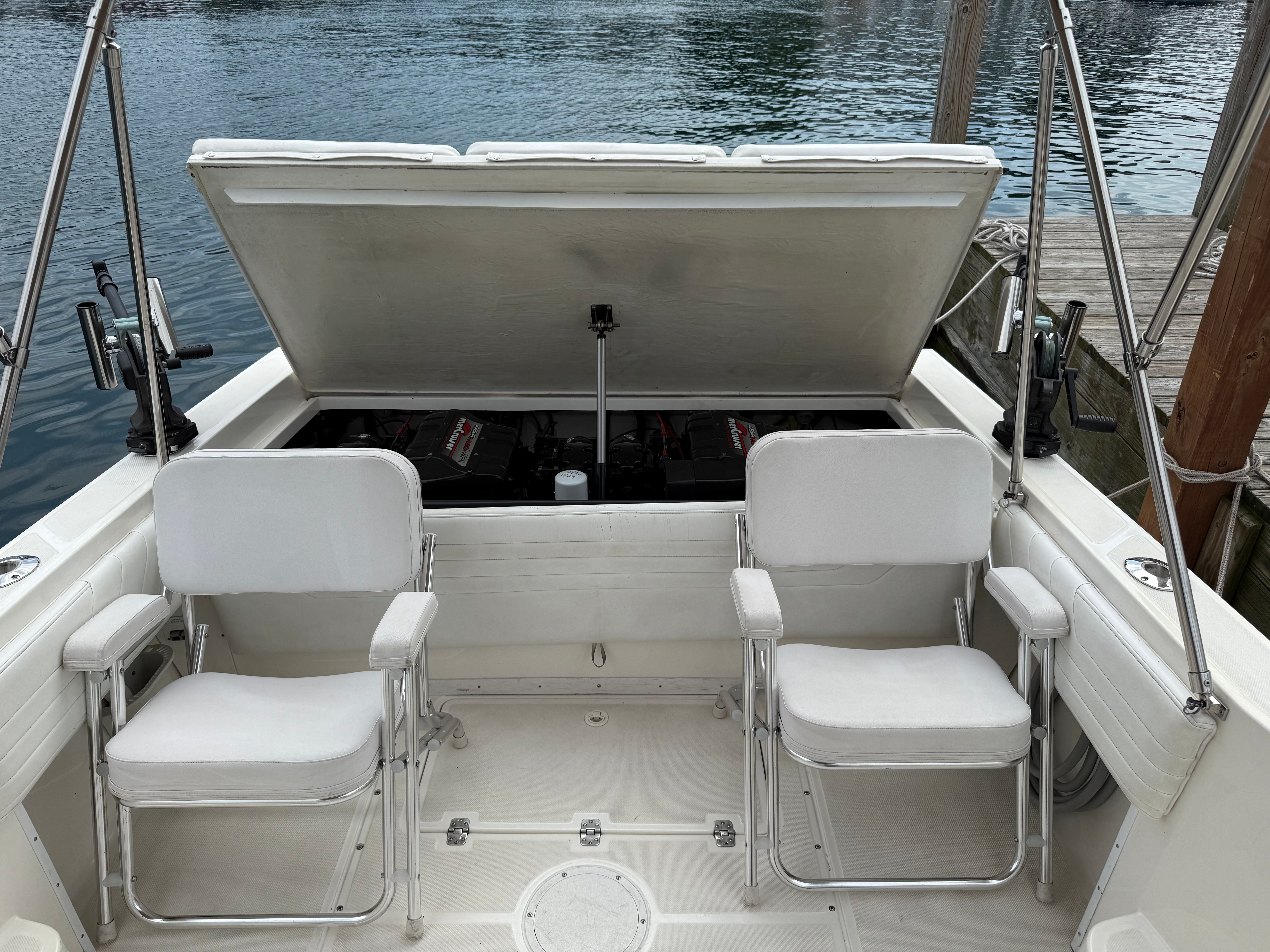 1999 Fountain 32 Sport Fish Cruiser with open engine compartment.