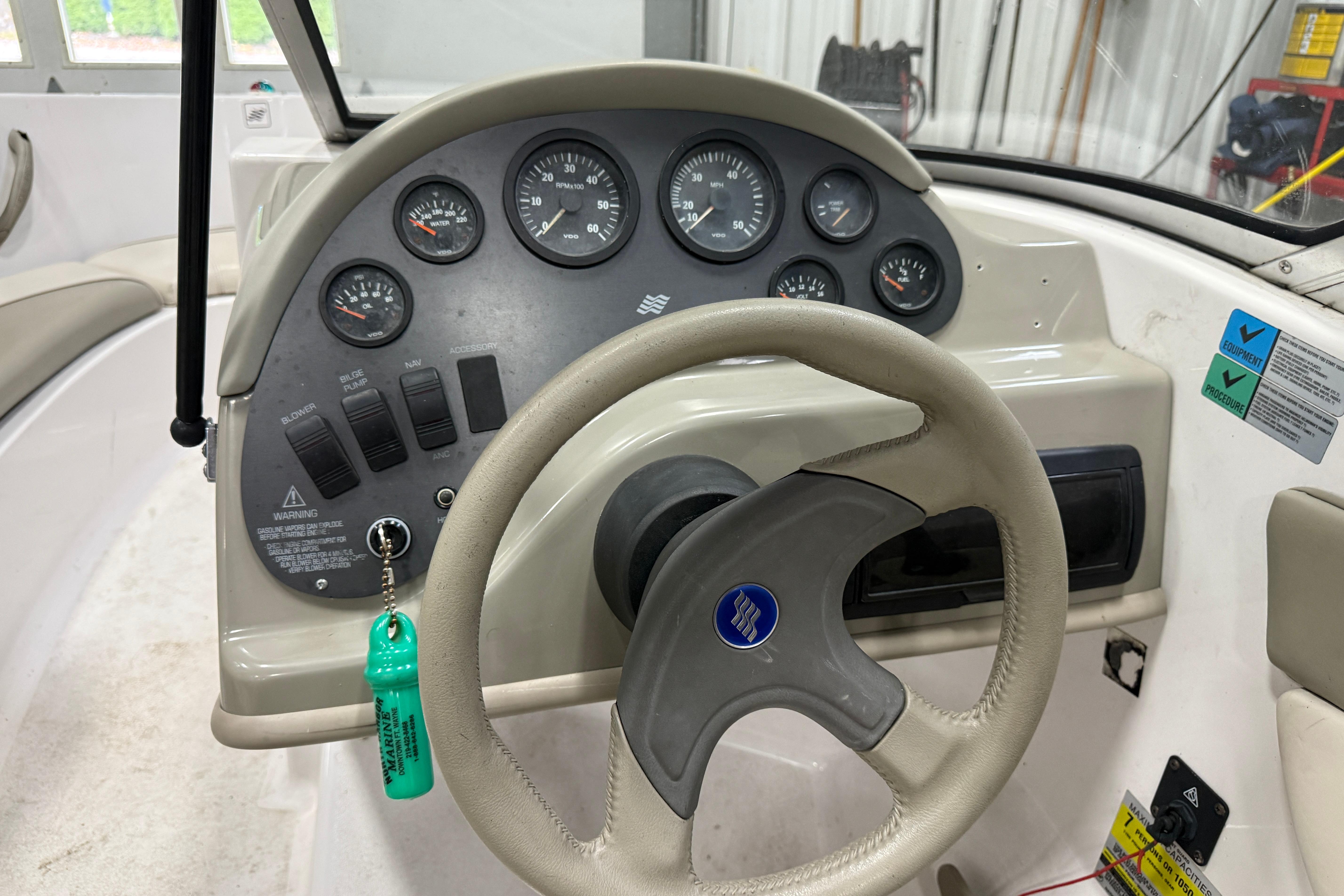 1999 Four Winns 170 Horizon LE boat dashboard with steering wheel and instrument panel.