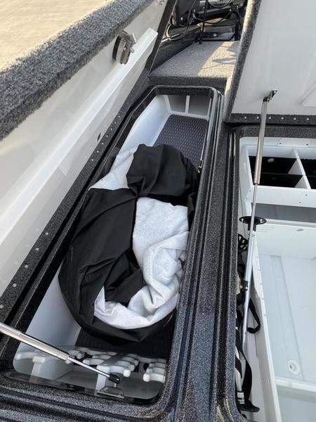 2024 Phoenix 20 XE boat storage compartments with gear and equipment.