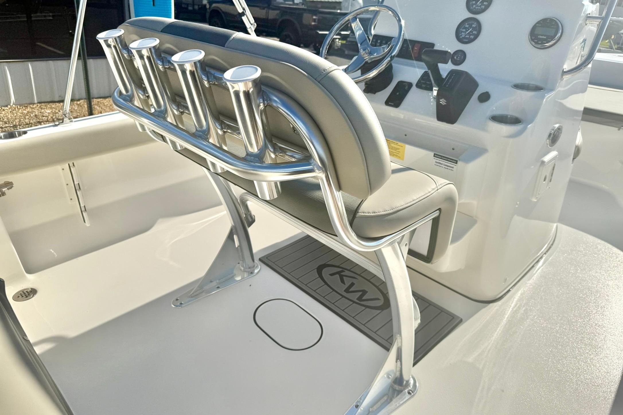 2026 Key West 189 FS boat interior with helm, rod holders, and seating.
