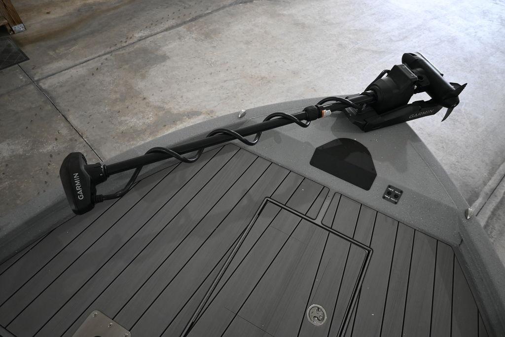 2026 Vexus ACX 2210 boat deck with Garmin trolling motor in a garage setting.