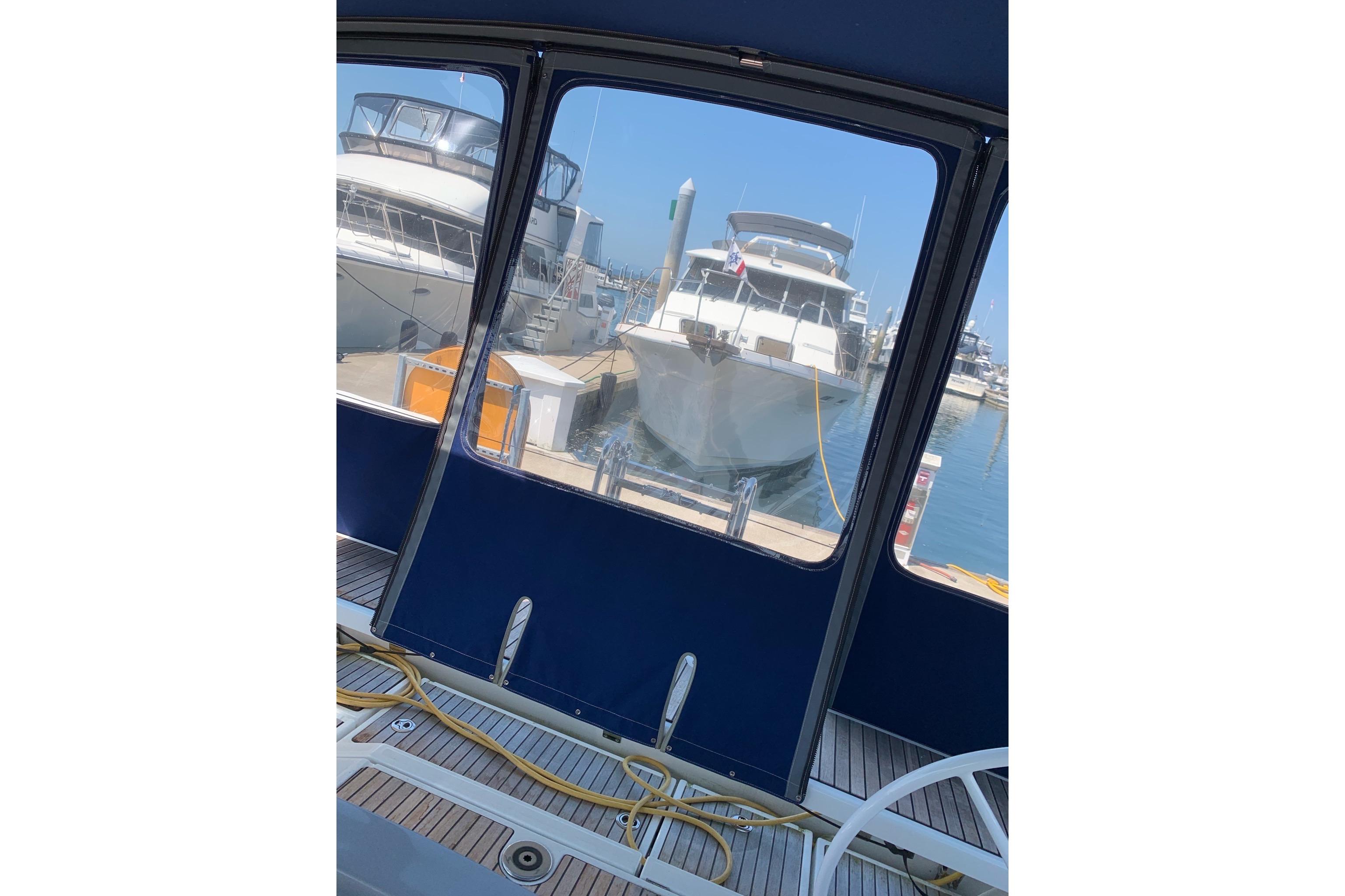View from Beneteau Oceanis 45, 2018 model, overlooking docked boats in marina.
