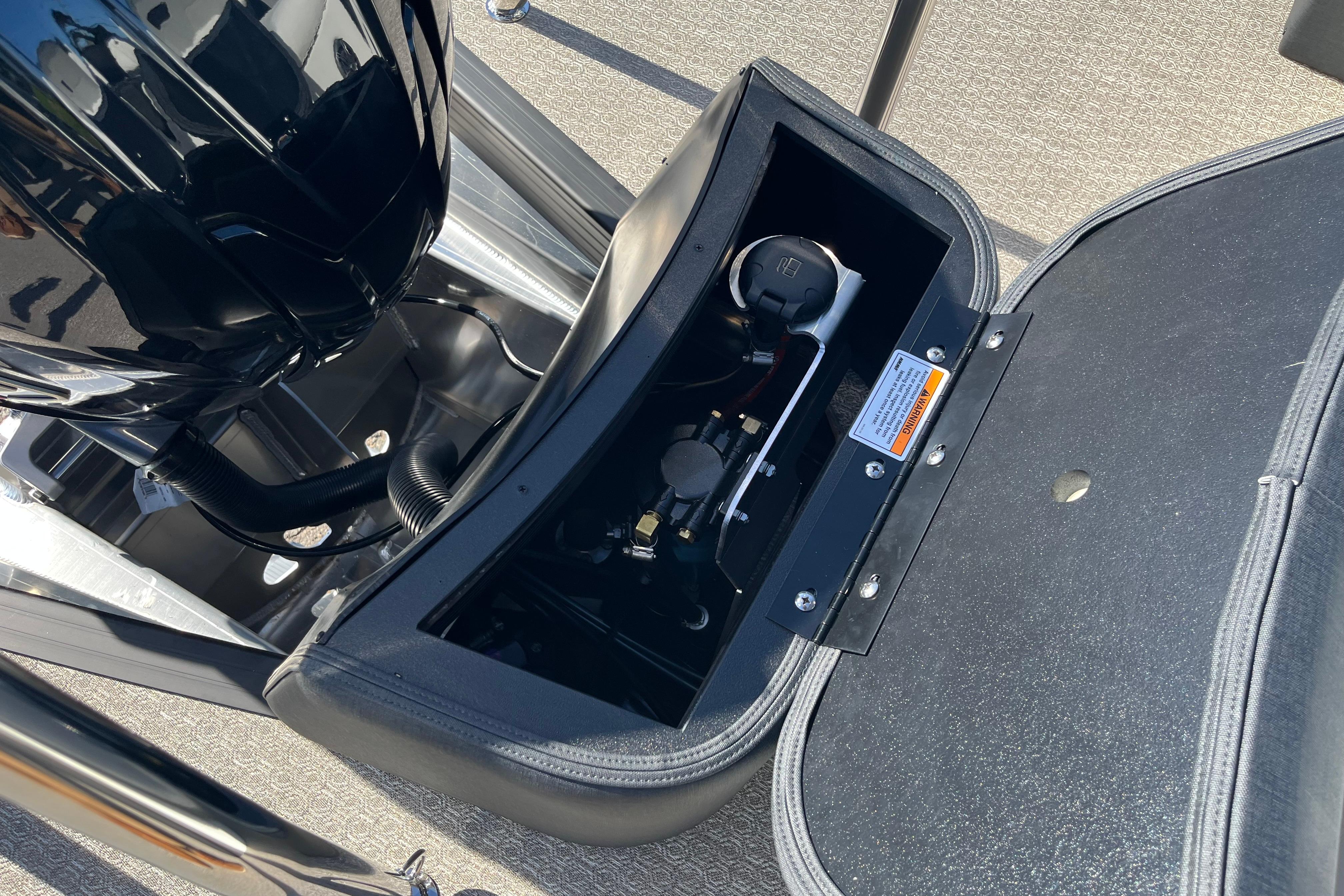 Open engine compartment of 2026 Evotti 523CS boat, showcasing internal components.
