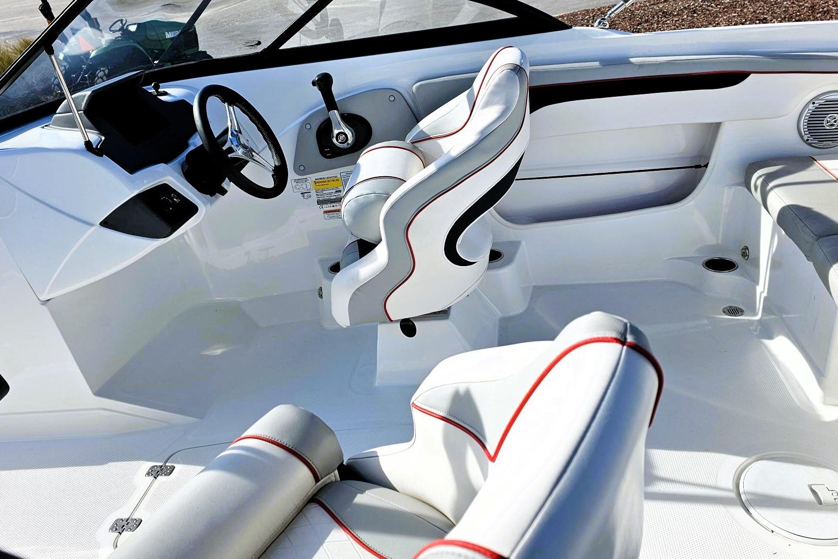 2023 Tahoe 210 Si boat interior with white seating and red accents.