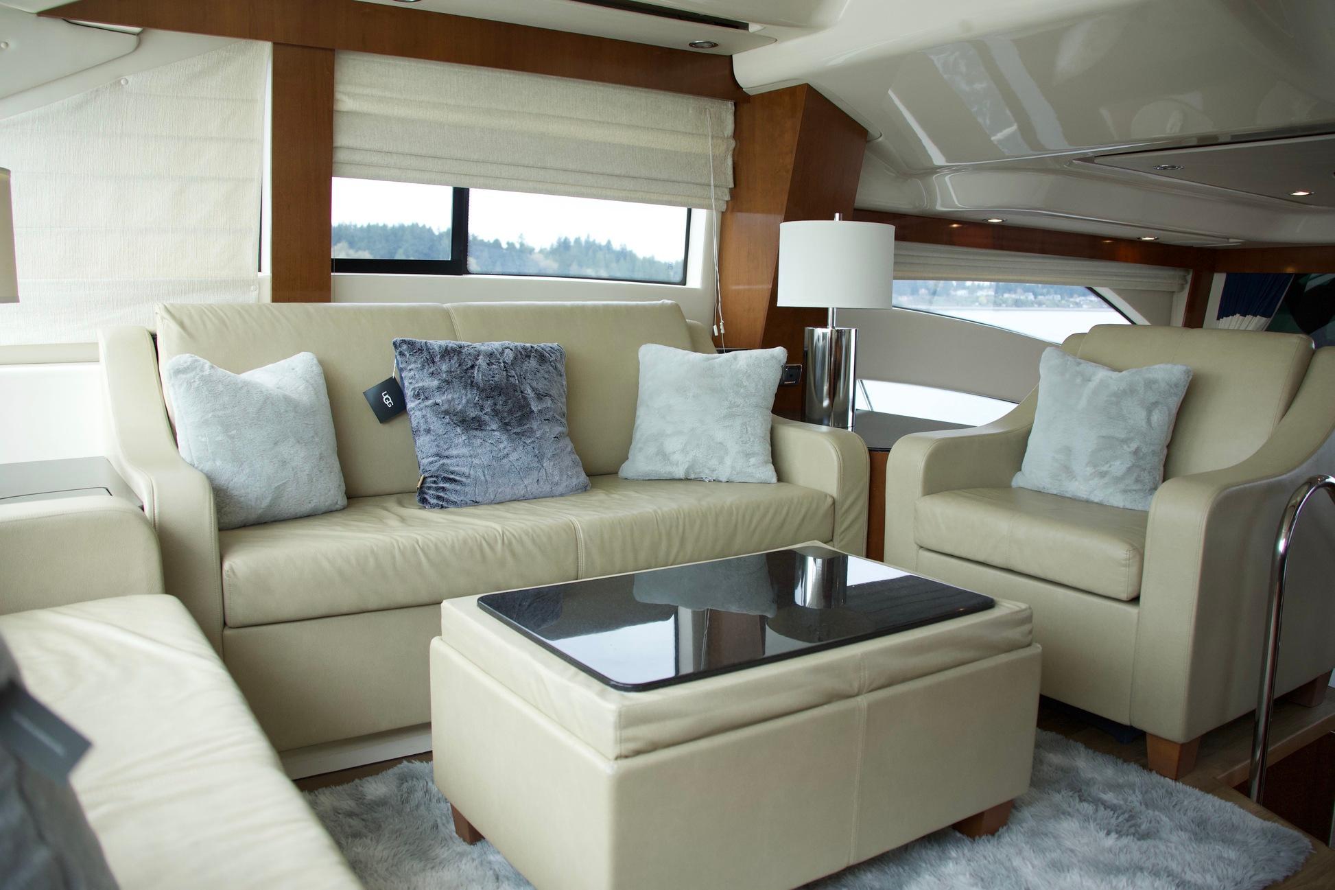 Luxurious interior of a 2012 Meridian 541 Sedan yacht with plush seating and elegant decor.