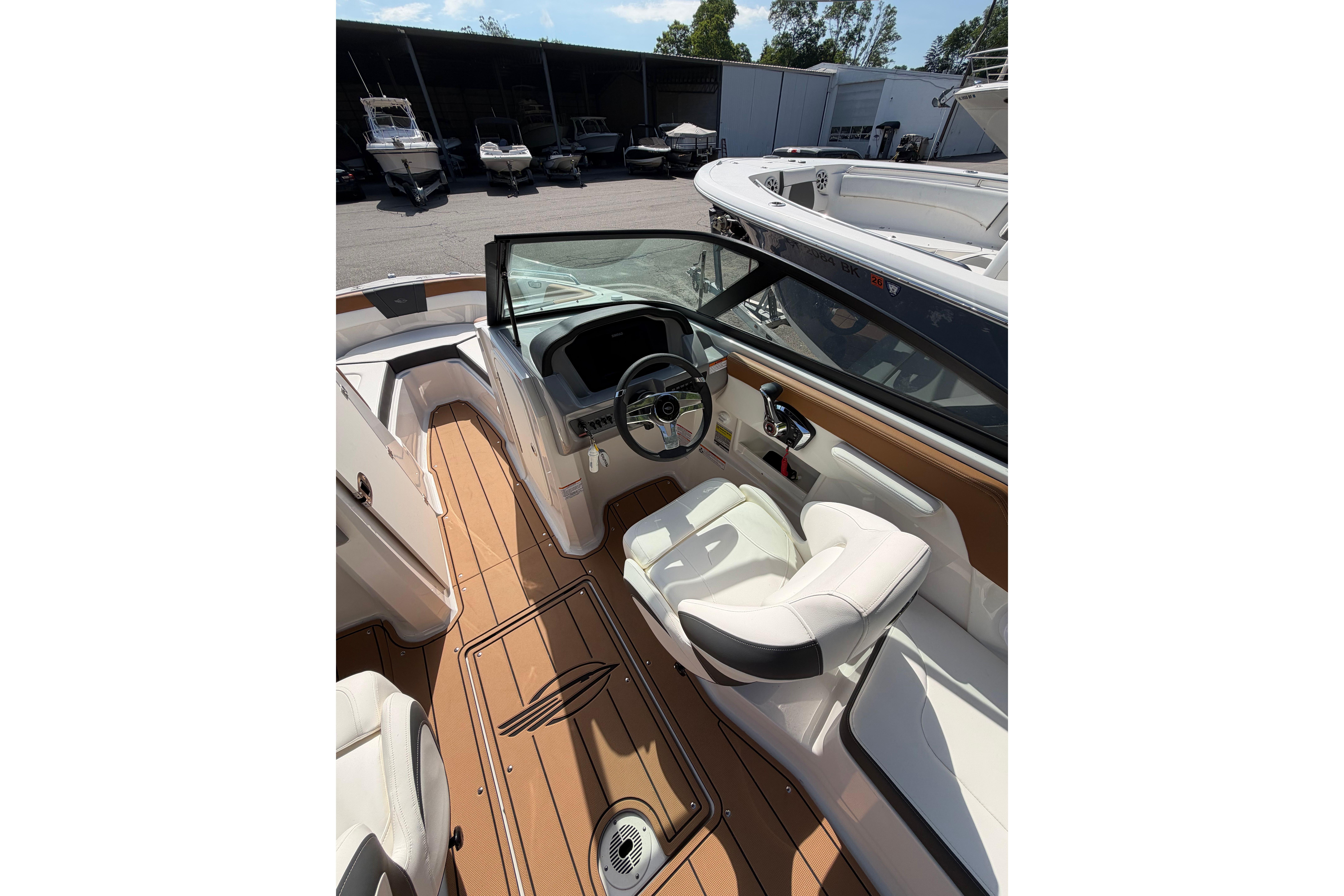 2025 Chaparral 230 SSi boat interior with sleek design and modern dashboard.