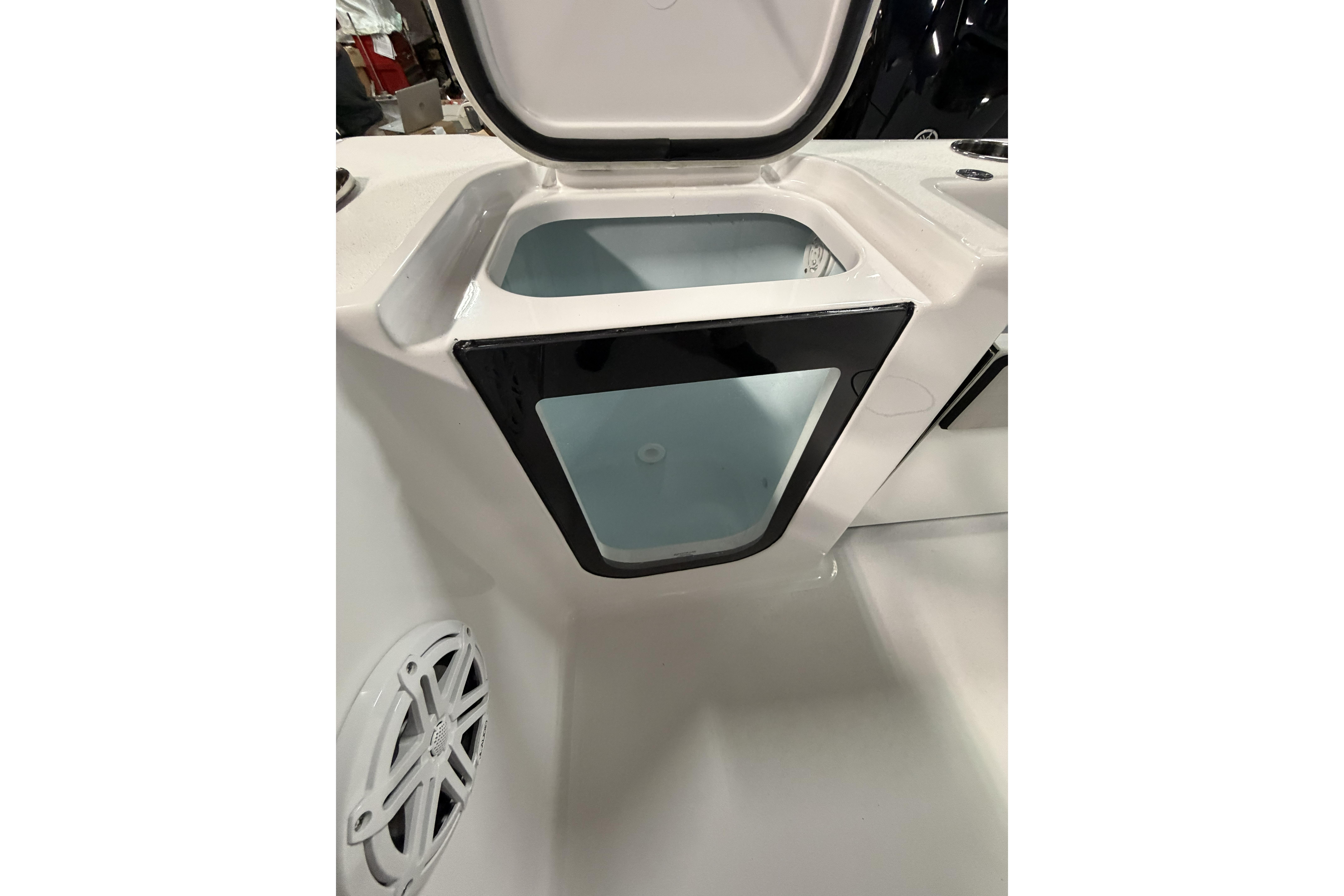Open storage compartment on 2026 Sportsman Open 232 Center Console boat.