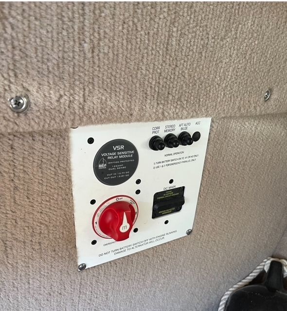 Close-up of a control panel with switches and a rotary knob.