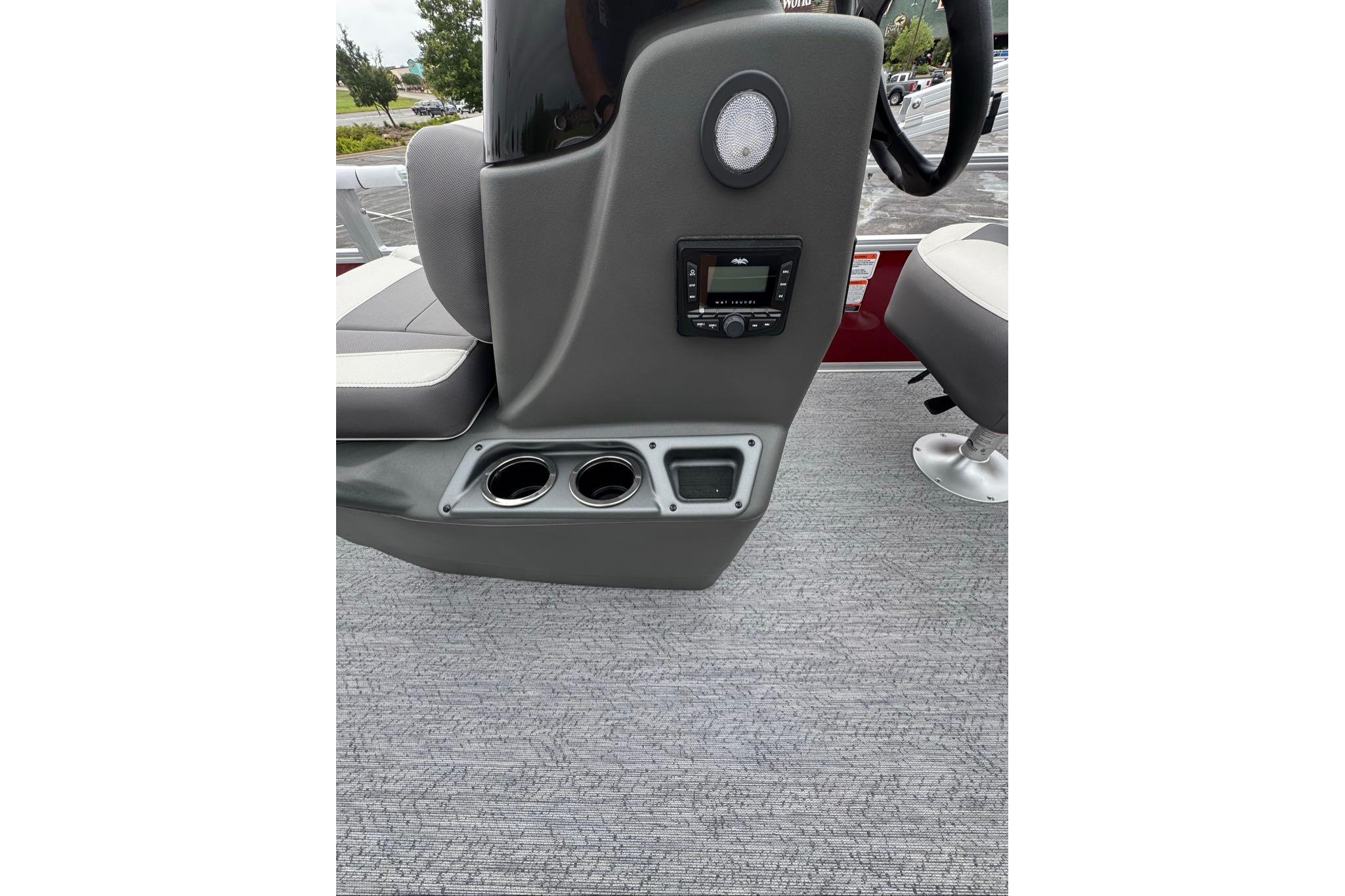 2026 Sun Tracker Bass Buggy 16 XL Select boat console with cup holders and audio controls.