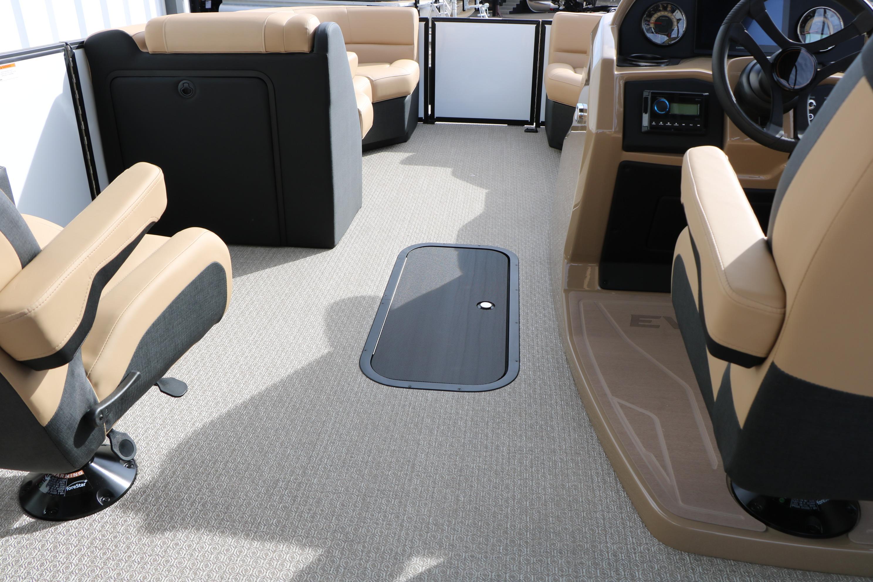 Interior of 2026 Evotti 523CS boat with beige seating and modern dashboard.