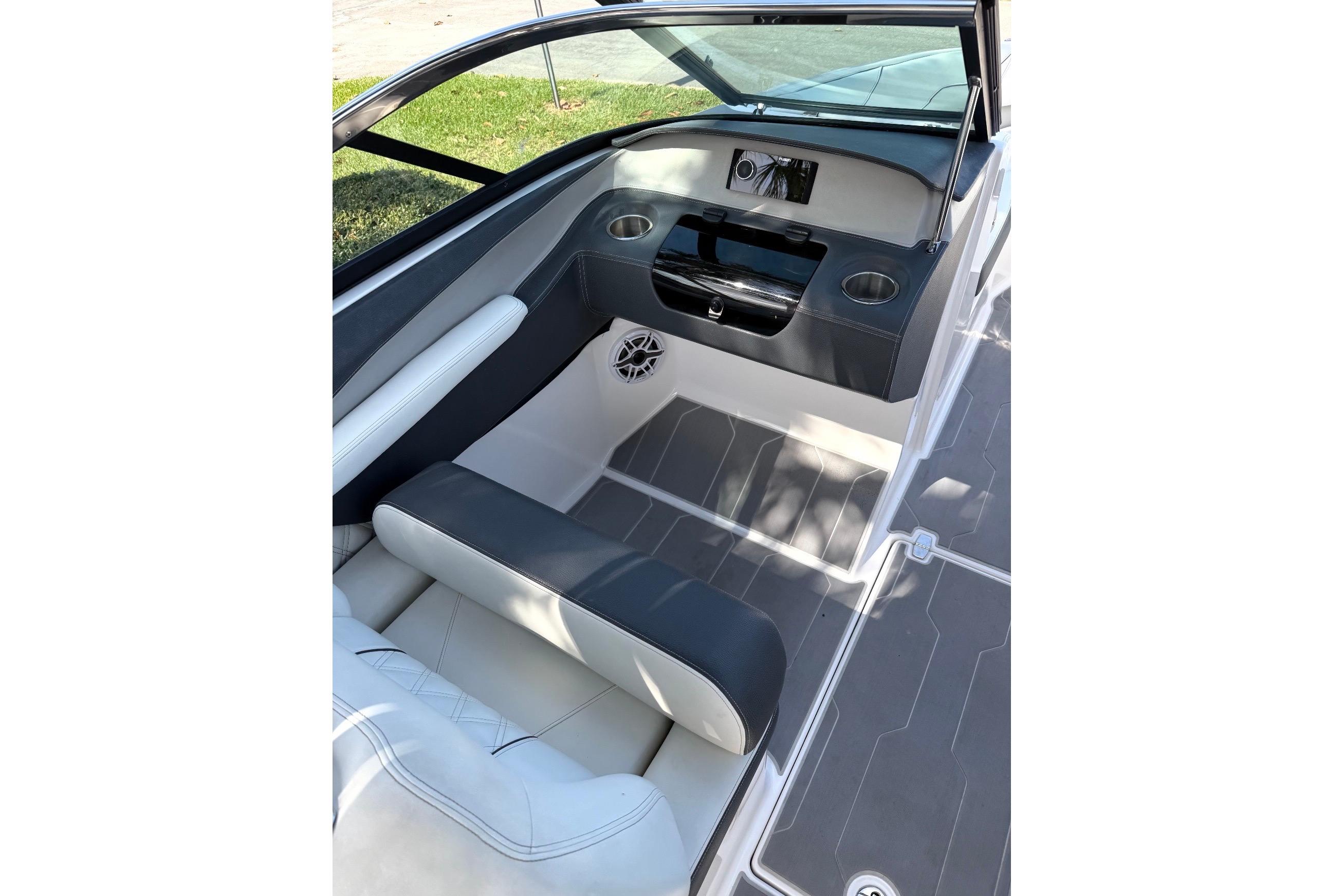 Interior of 2020 Regal LX4 boat with seating and dashboard view.