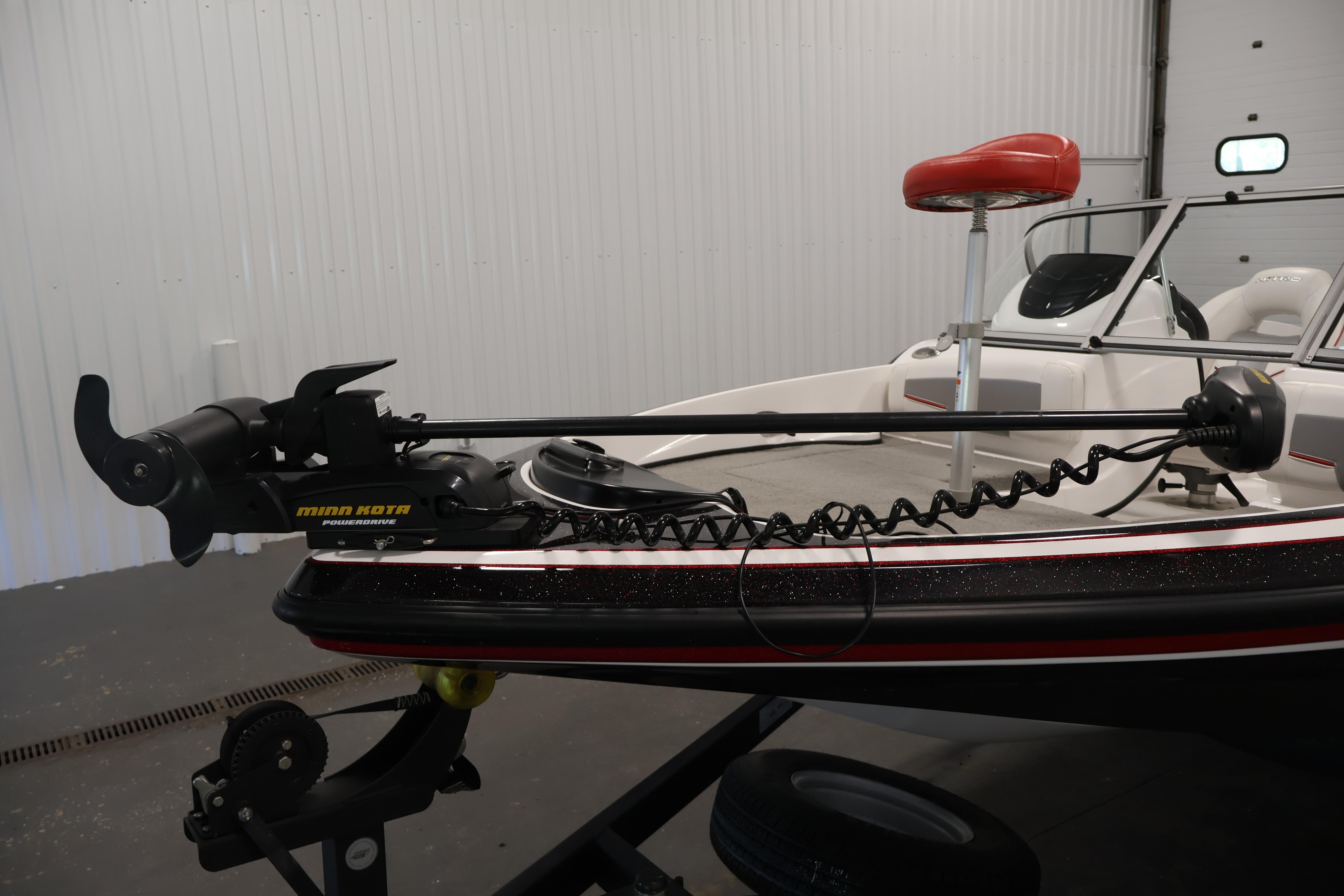 2019 Nitro Z19 Sport boat with Minn Kota trolling motor in a garage.