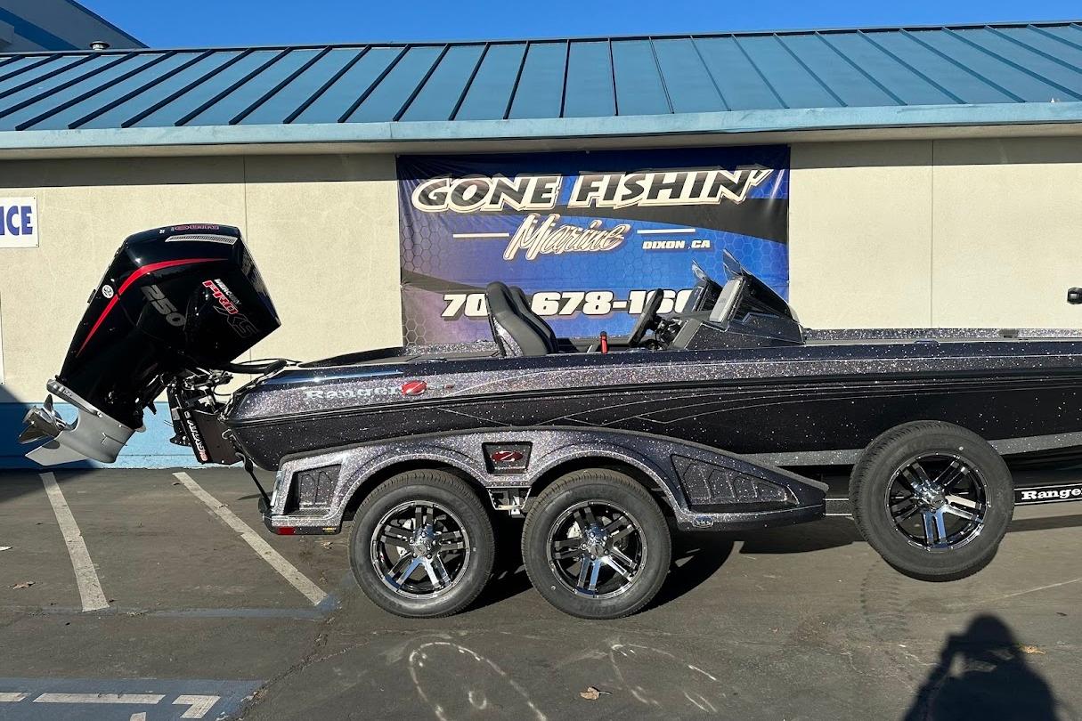 2026 Ranger Z521R Garmin Cup-Equipped boat with powerful outboard motor, parked outside dealership.