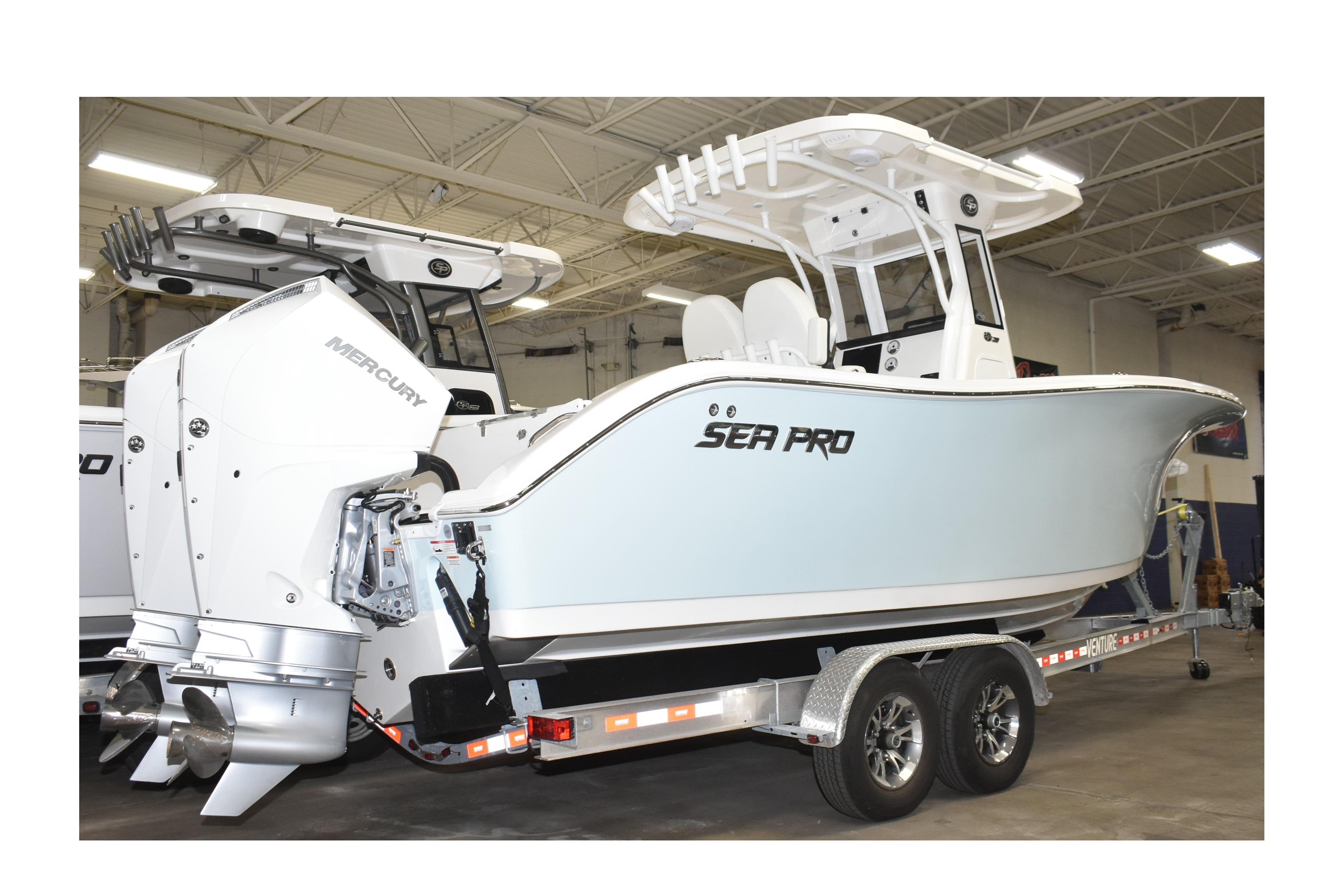2025 Sea Pro 262 Offshore boat with dual Mercury engines on a trailer.