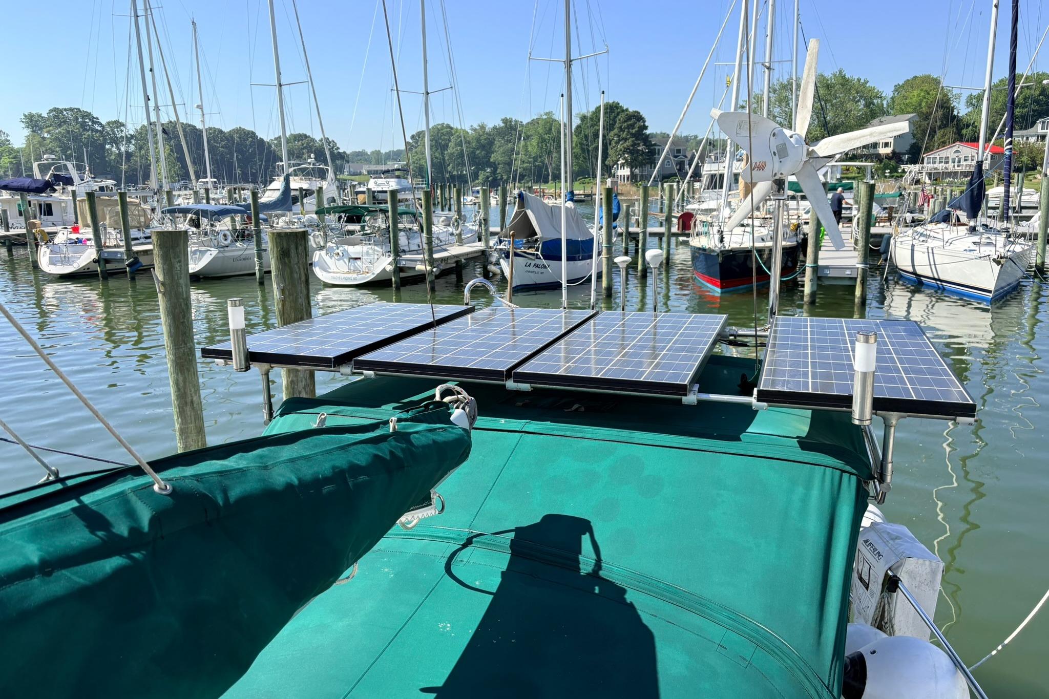 Sailboat with solar panels docked at marina, Caliber 40LRC SE, 2009 model.