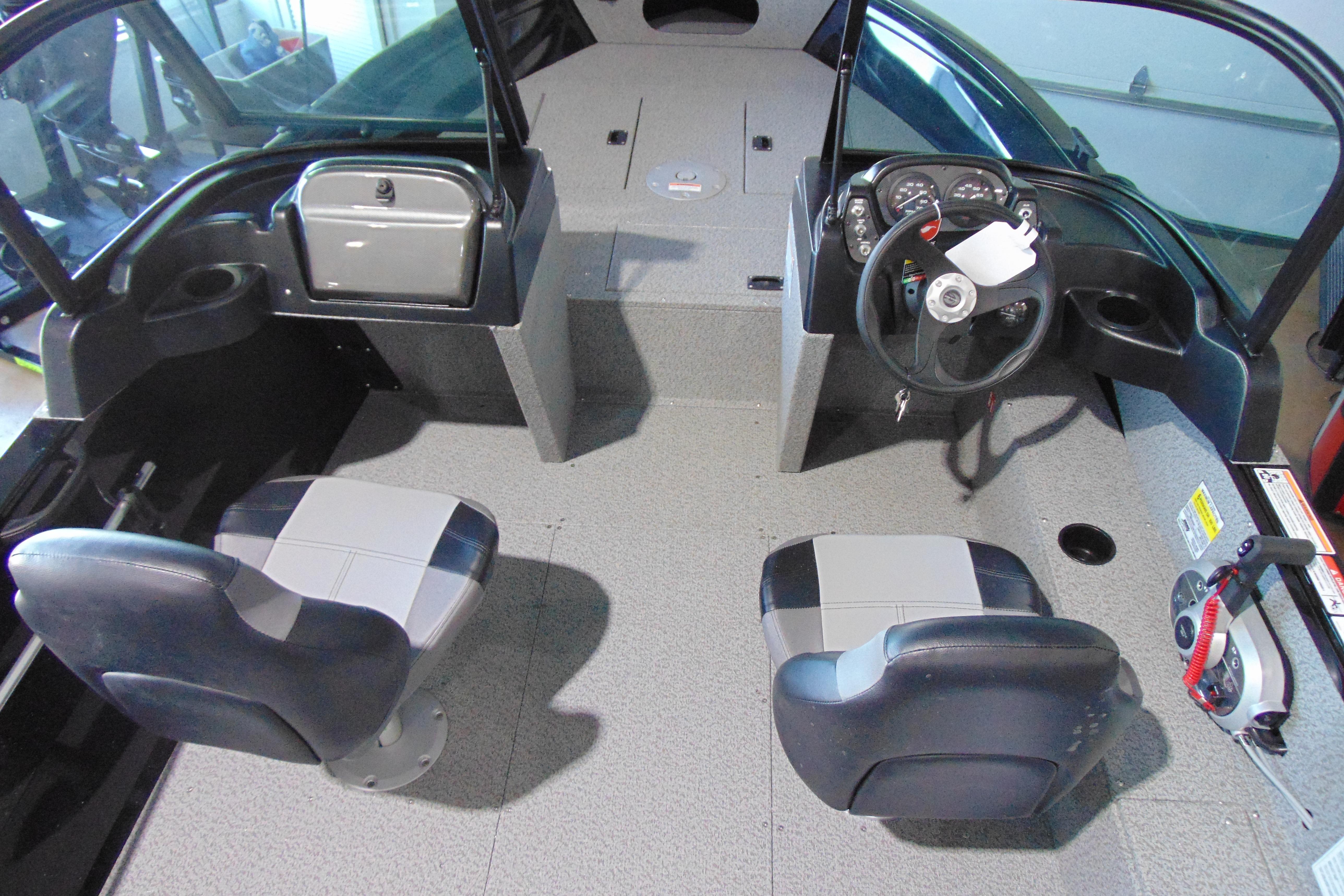 2026 Crestliner 1850 Kodiak WT boat interior with dual seats and steering console.