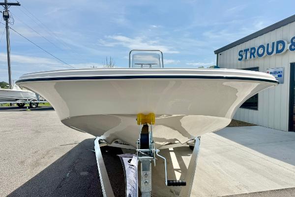 2025 Carolina Skiff 21 LS boat on trailer, parked outside dealership.