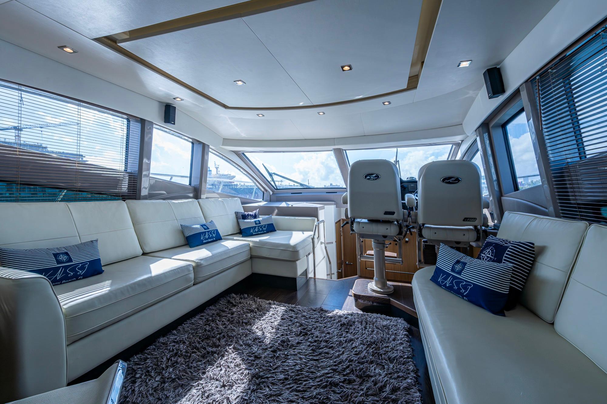 Luxurious interior of 2018 Sea Ray L550 Fly yacht with plush seating and modern design.