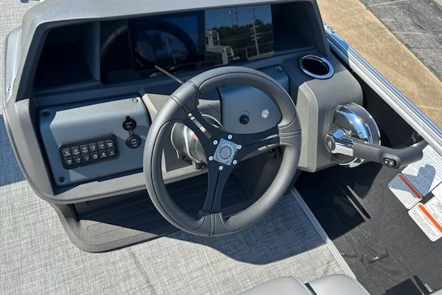 Steering console of 2026 Sun Tracker Party Barge 20 DLX pontoon boat.