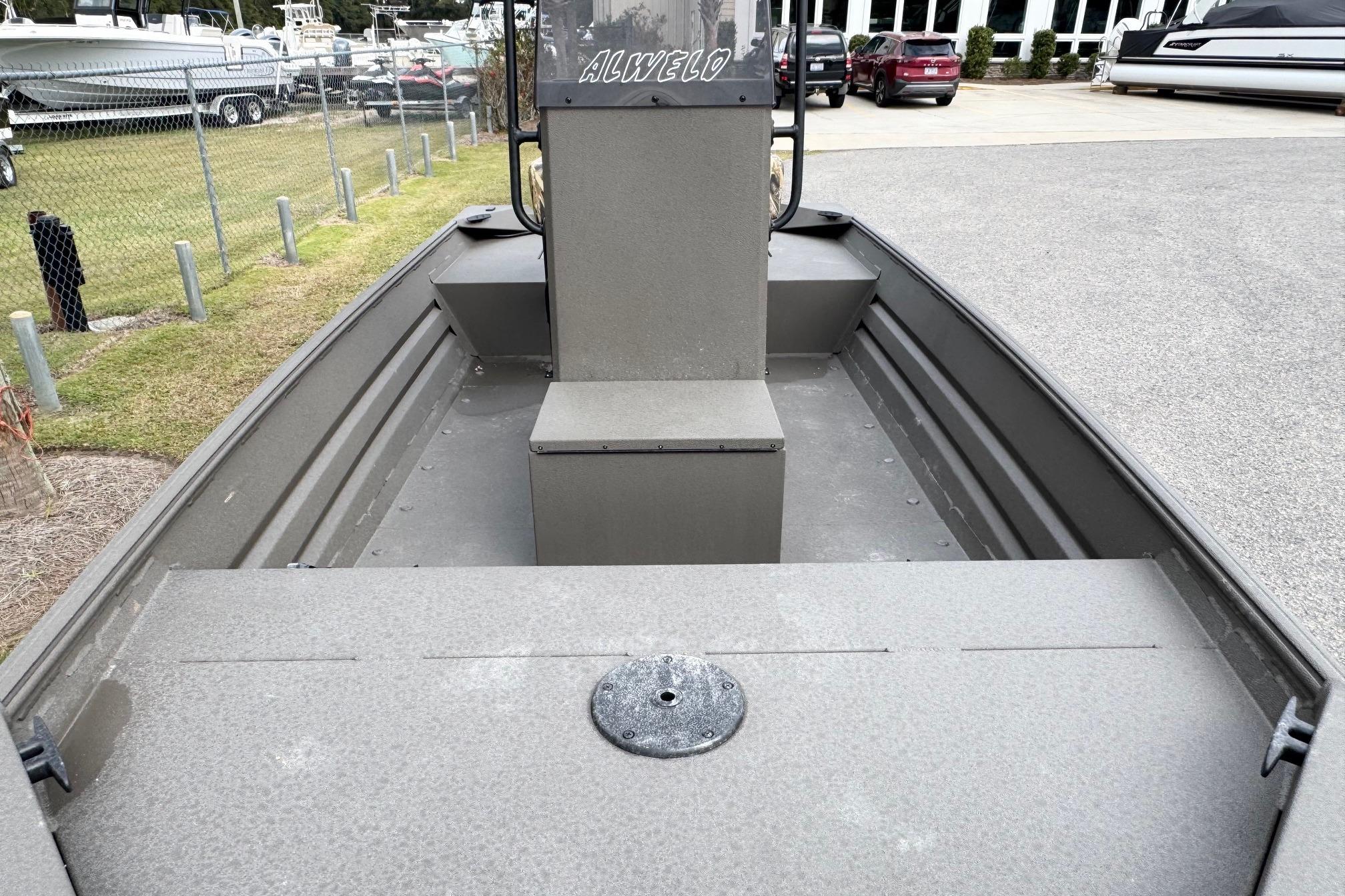 2026 Alweld 1656VV Marsh Console CC boat, gray interior, parked outdoors.