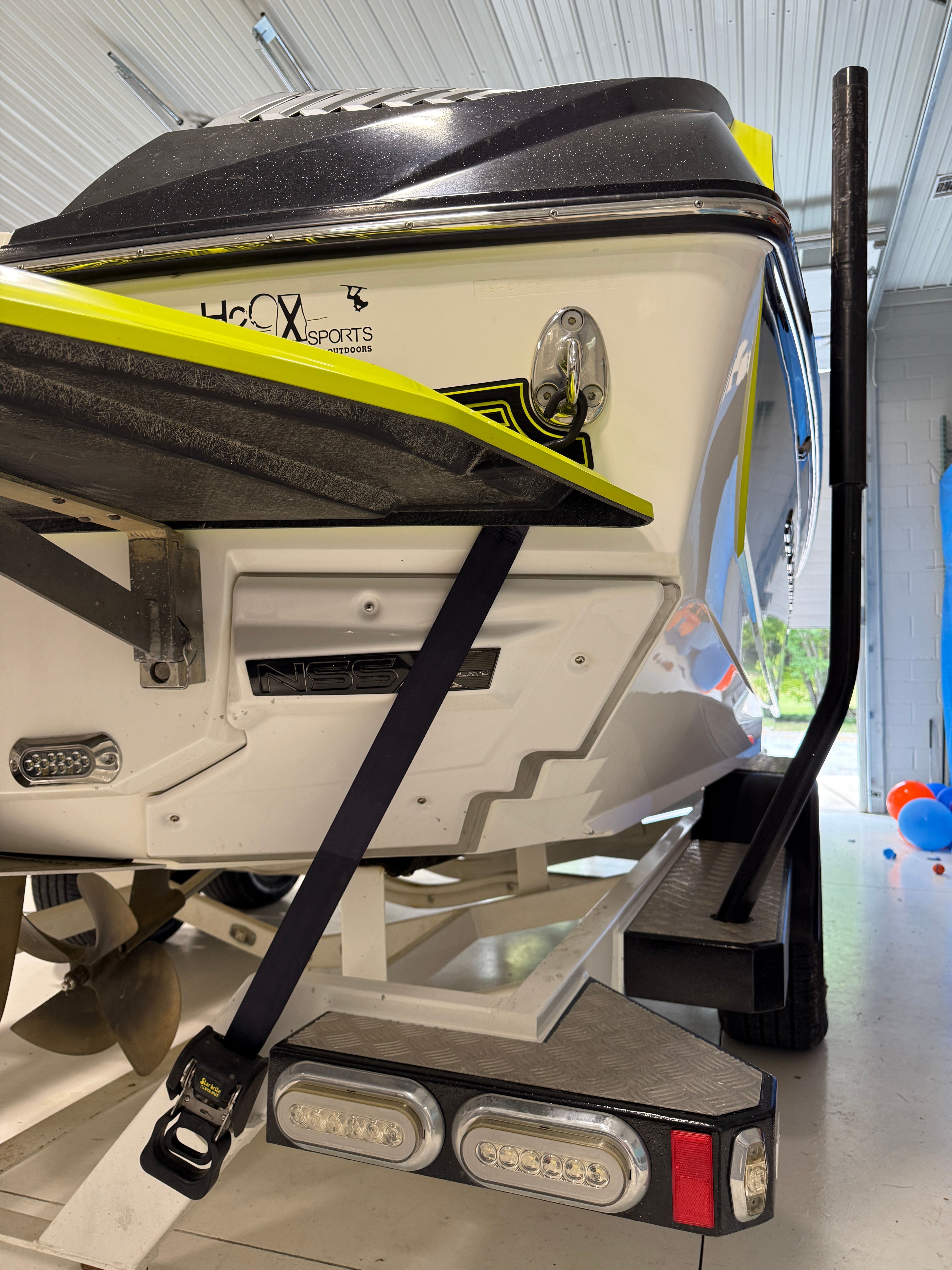 The image shows the rear of a 2016 Super Air Nautique G23 on a trailer.