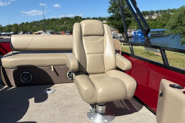 Luxurious seating on 2025 Regency 250 DL3 boat with scenic lake view.