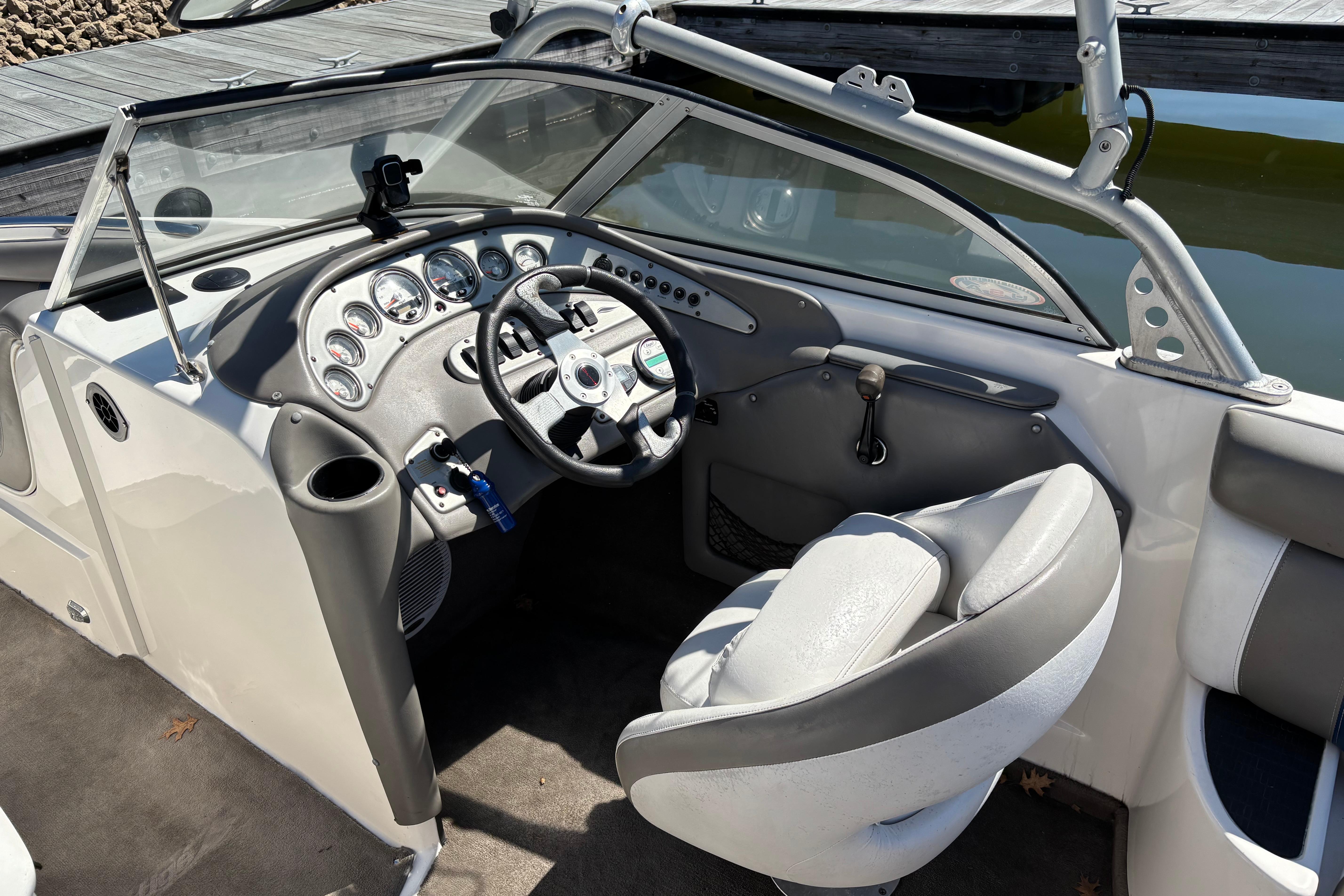 2004 Tigé 22V Limited Edition boat interior with steering wheel and dashboard controls.