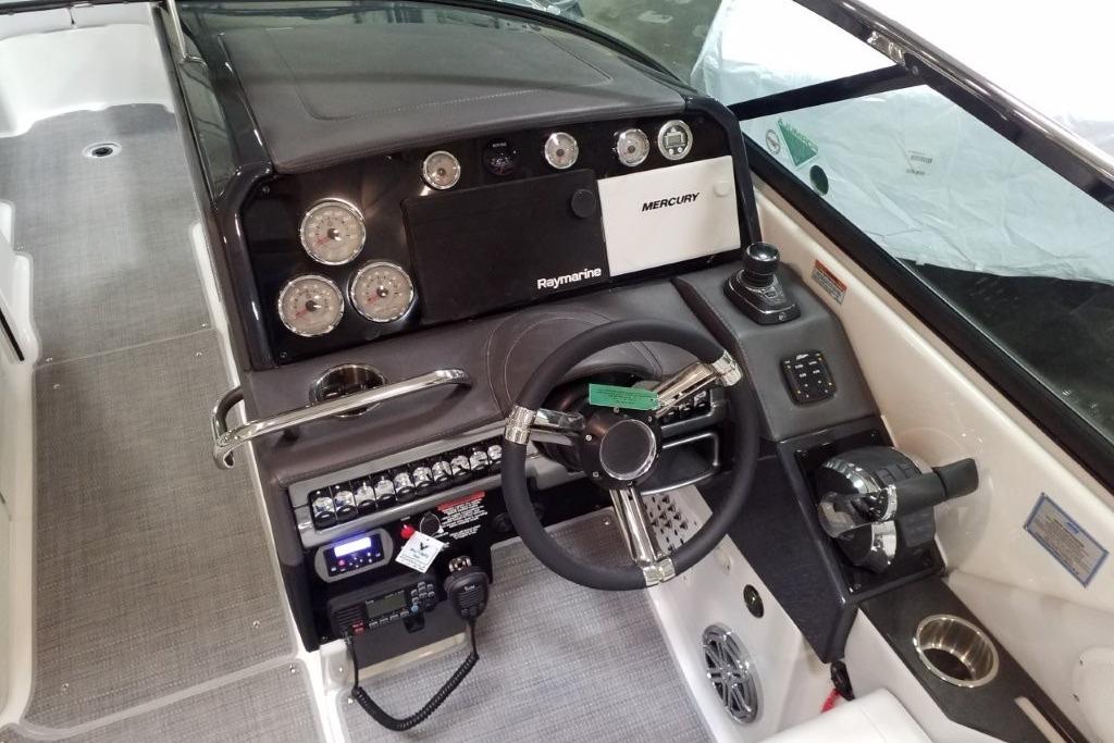 2020 Formula 310 Bowrider OB dashboard with steering wheel and control panel.