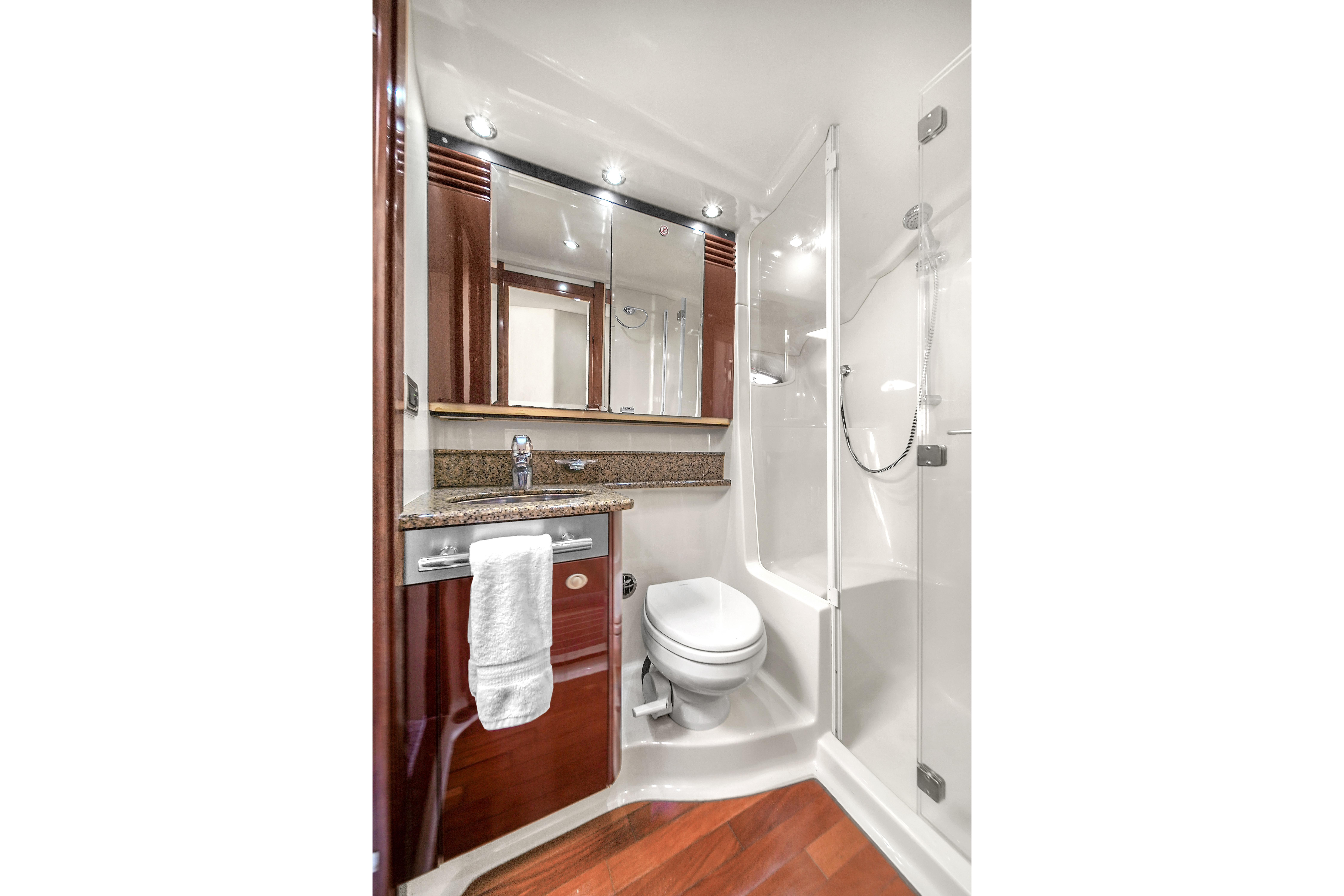 Luxurious bathroom in 2007 Sea Ray 52 Sedan Bridge yacht with modern fixtures.