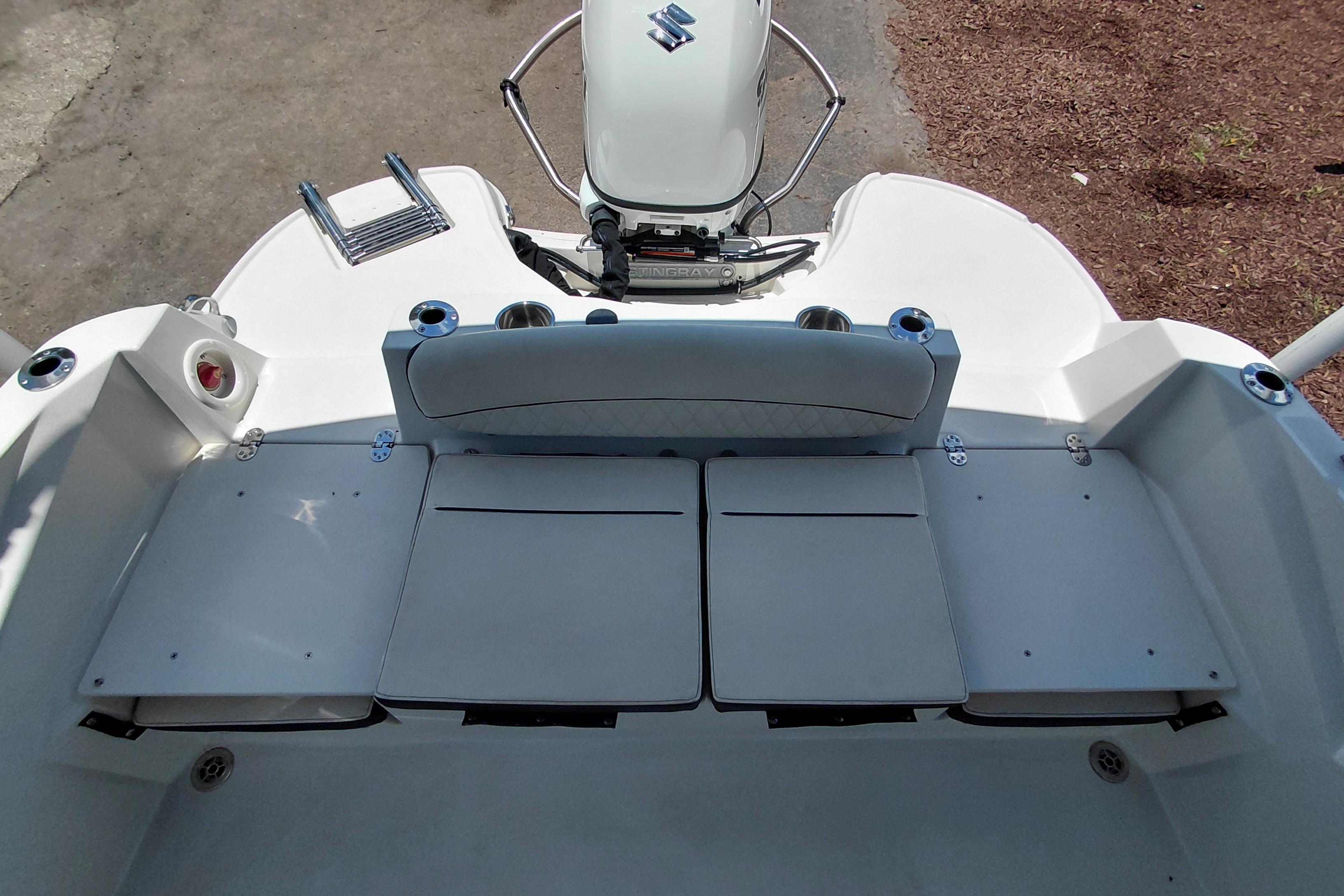 2023 Stingray 206 CC boat interior with seating and motor, top view.