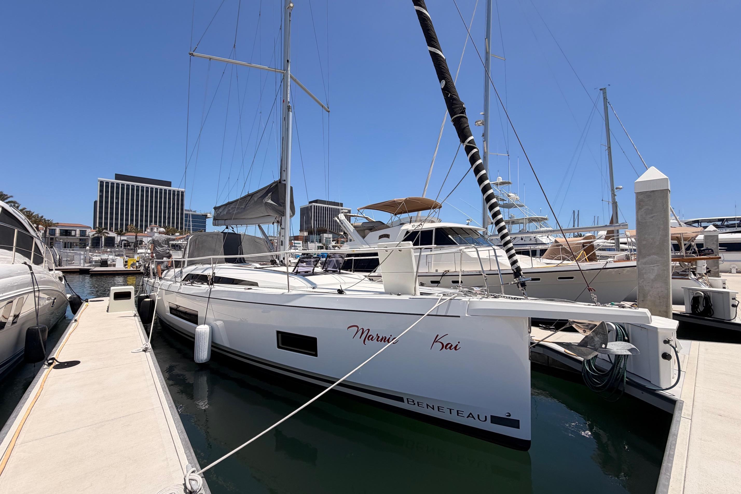 Beneteau Oceanis 46.1 sailboat docked at marina, 2020 model, clear blue sky.