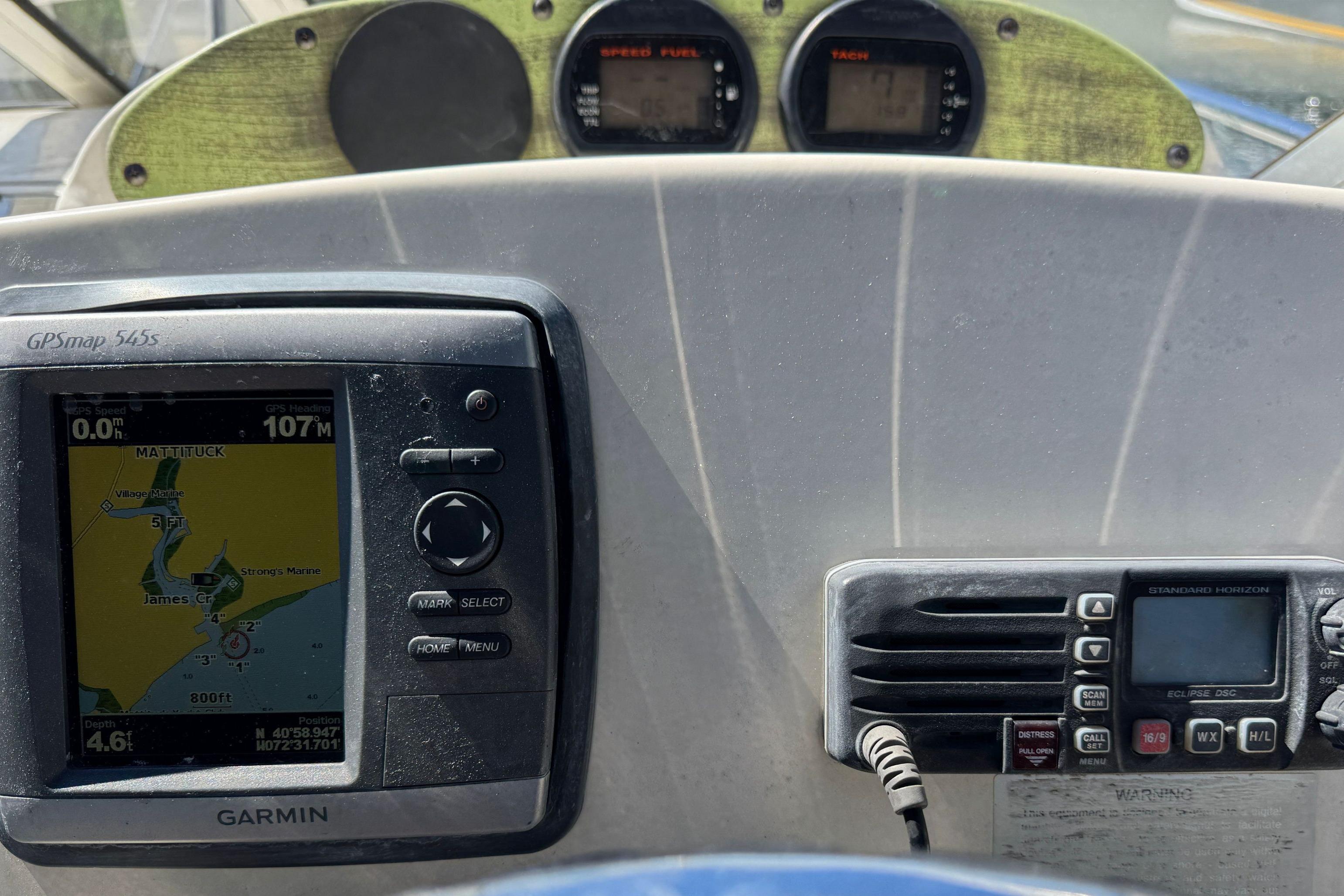 Dashboard of a 2008 Scout 222 Abaco boat with GPS and radio equipment.