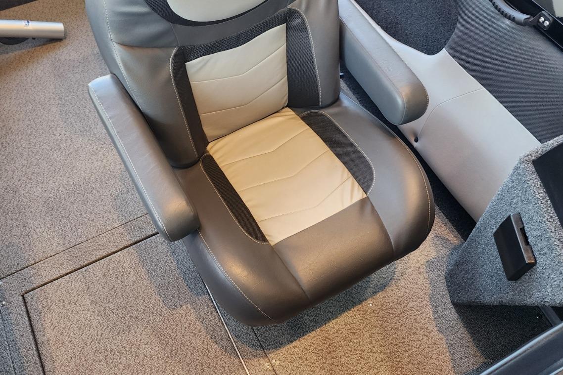 Comfortable boat seat with gray and beige upholstery, 2023 Lowe model.