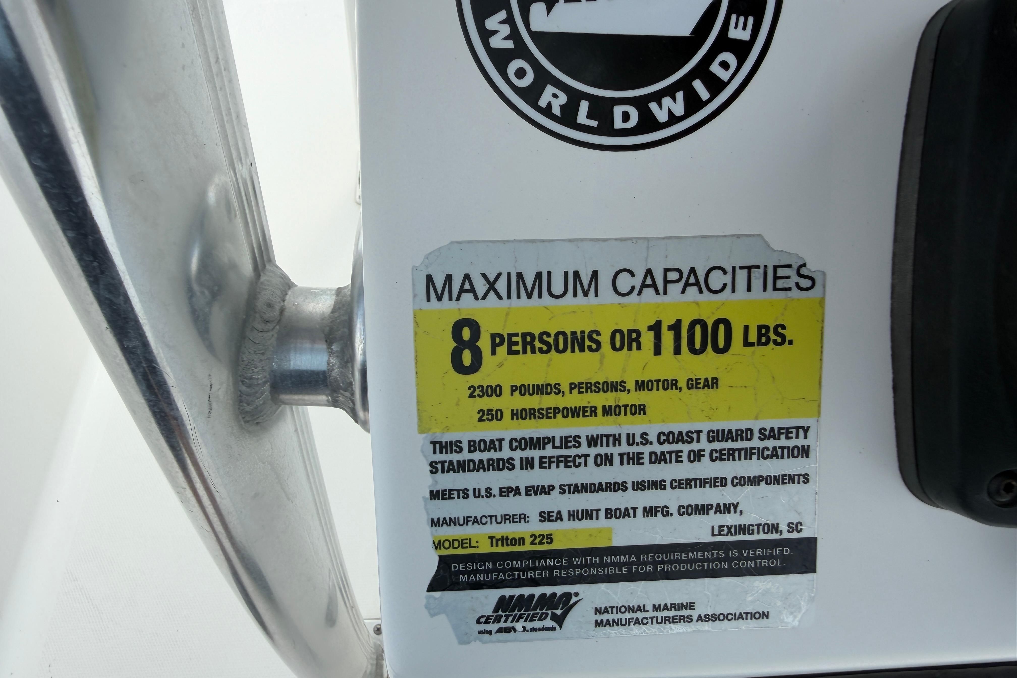 Capacity label on 2015 Sea Hunt Triton 225, indicating 8 persons or 1100 lbs.