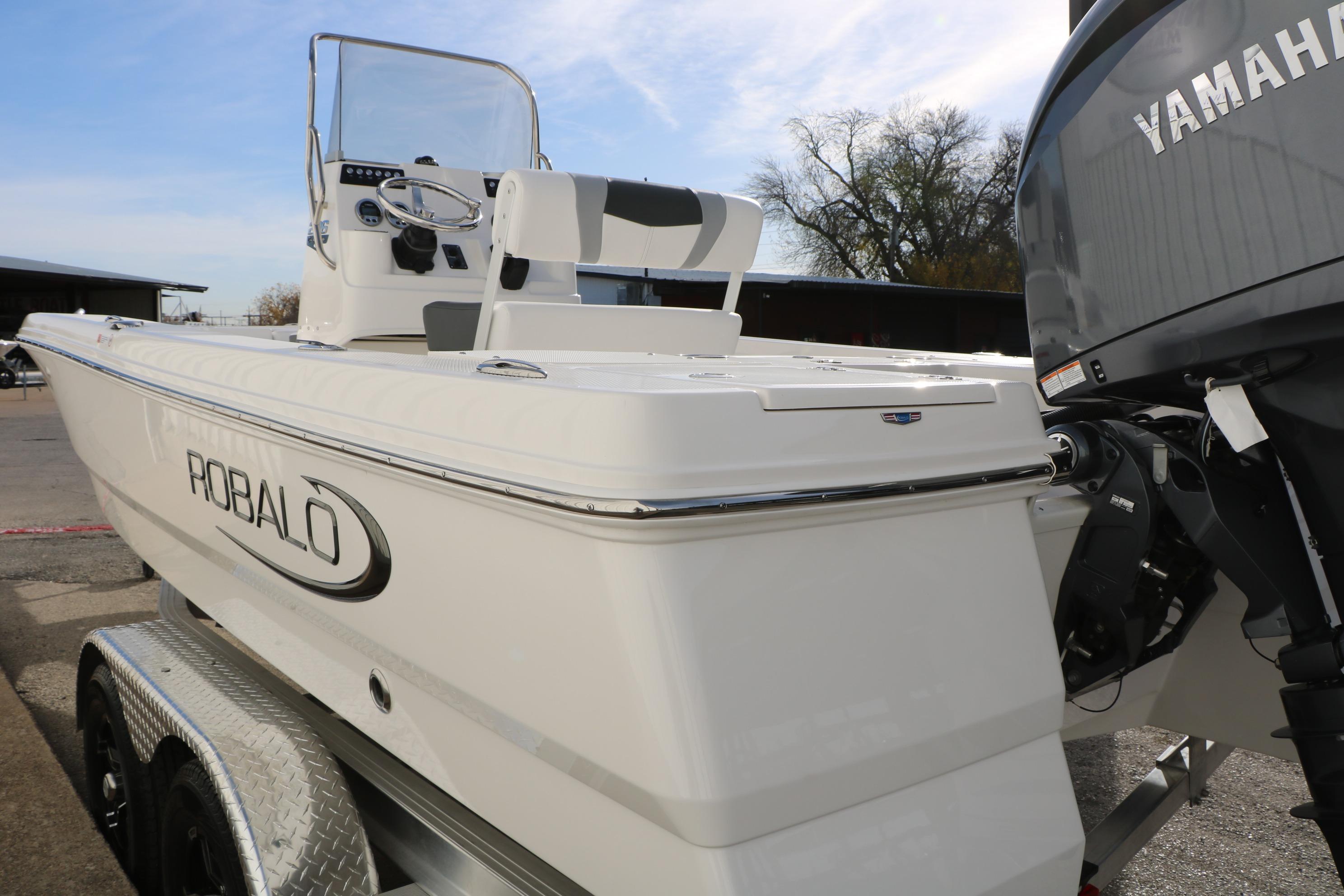 2026 Robalo 206 Cayman boat with Yamaha engine on trailer, side view.