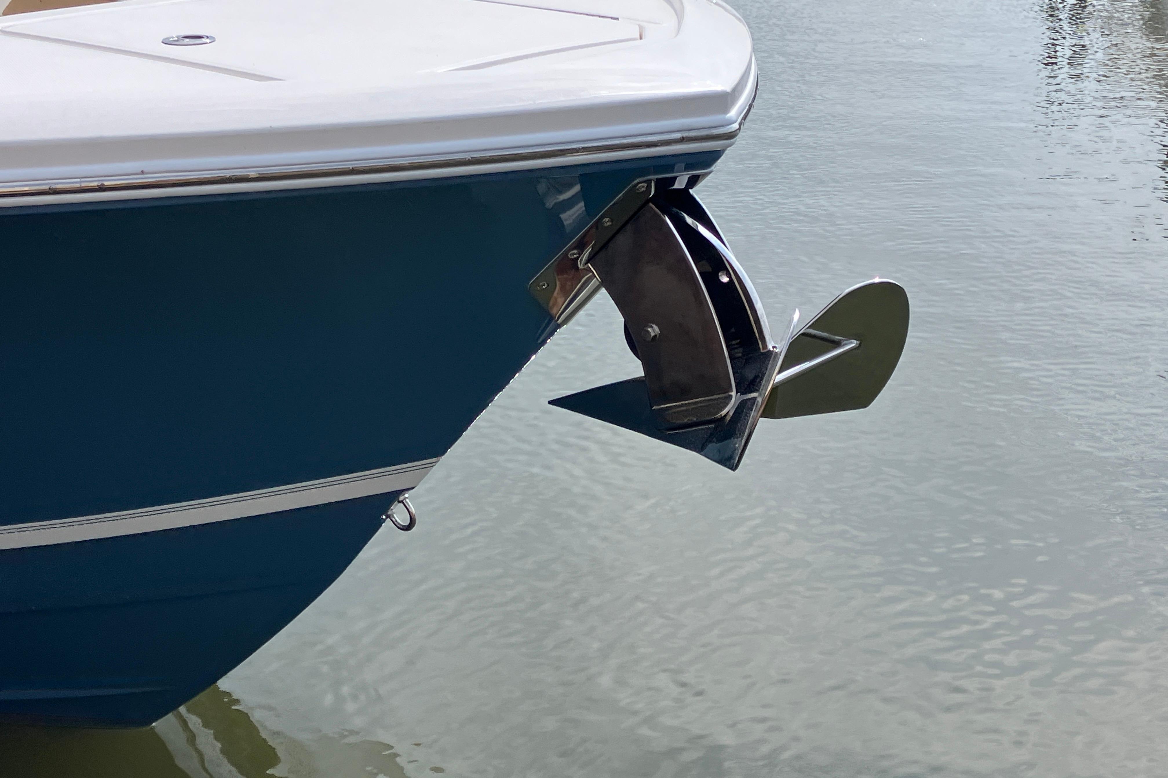 Bow of 2027 Regulator 35 boat with anchor over calm water.