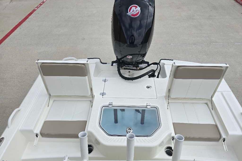 2026 Mako Pro Skiff 19 CC boat with open seating and motor, viewed from above.