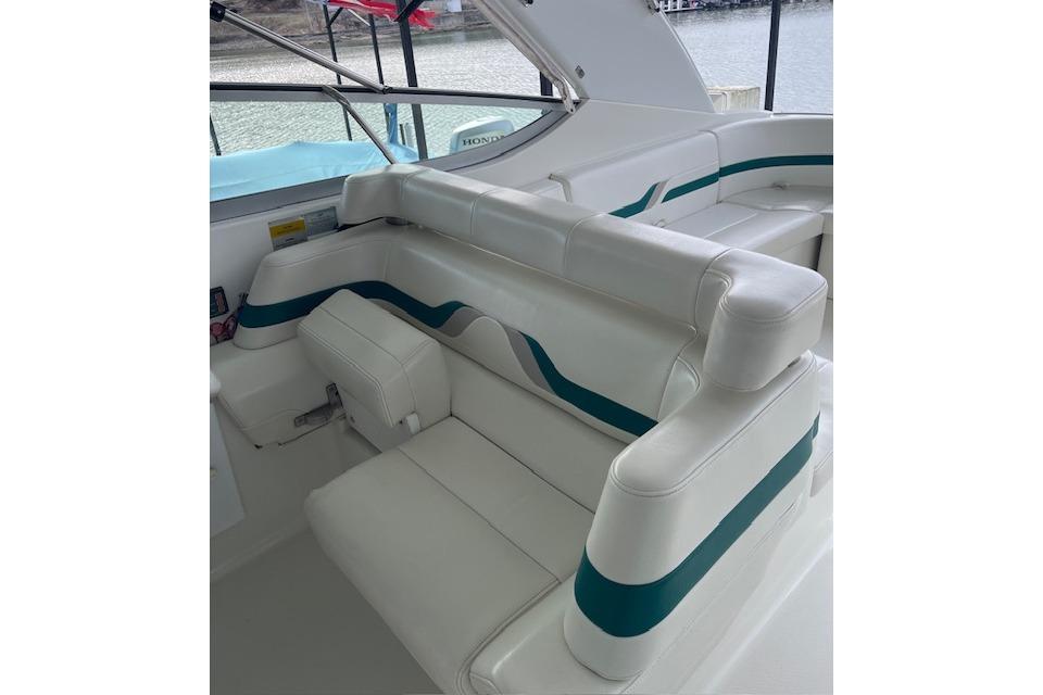 1999 Formula 400 Super Sport boat interior with white and teal seating.