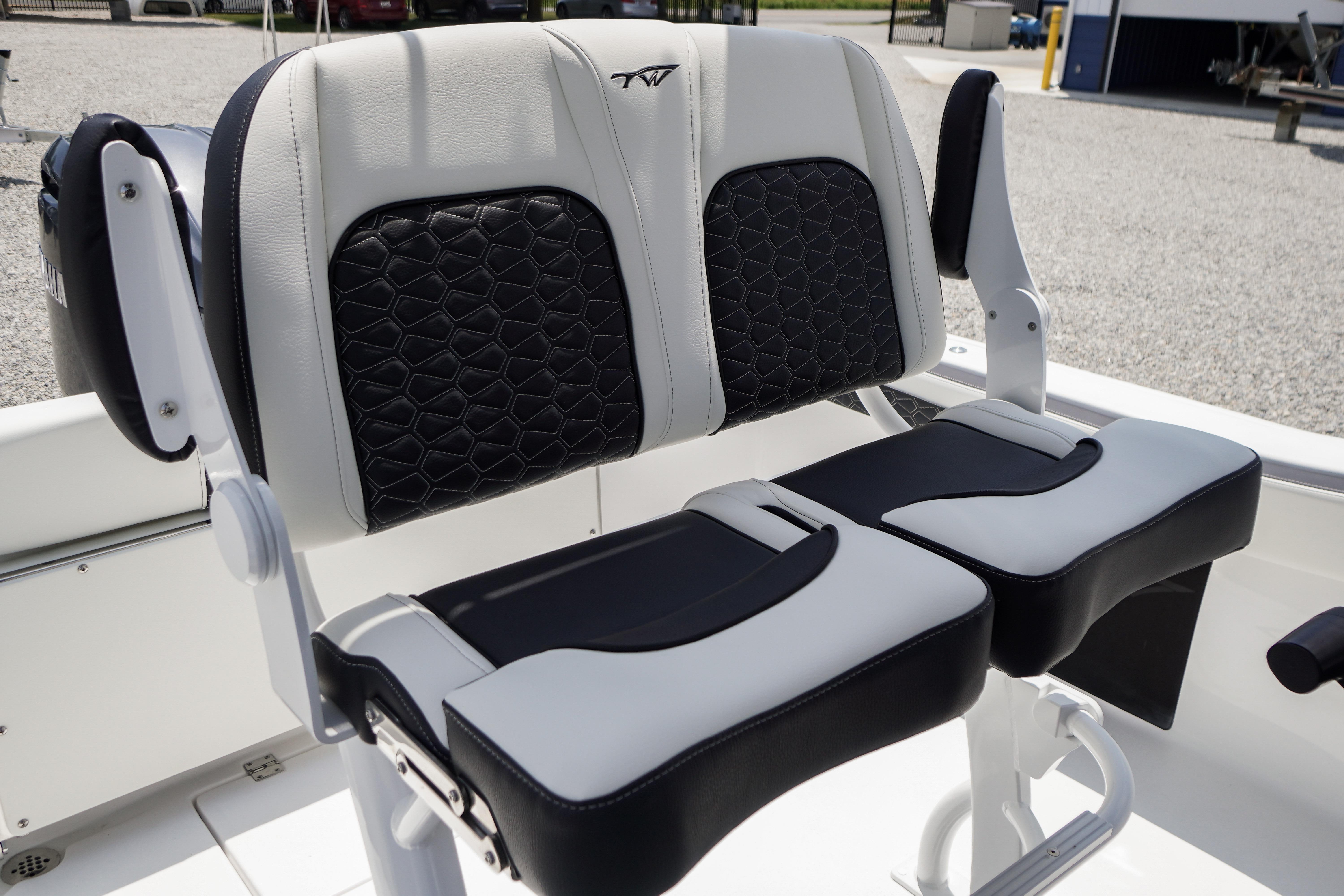 2027 Tidewater 220 CC Adventure boat seats with black and white upholstery, showcasing modern design.