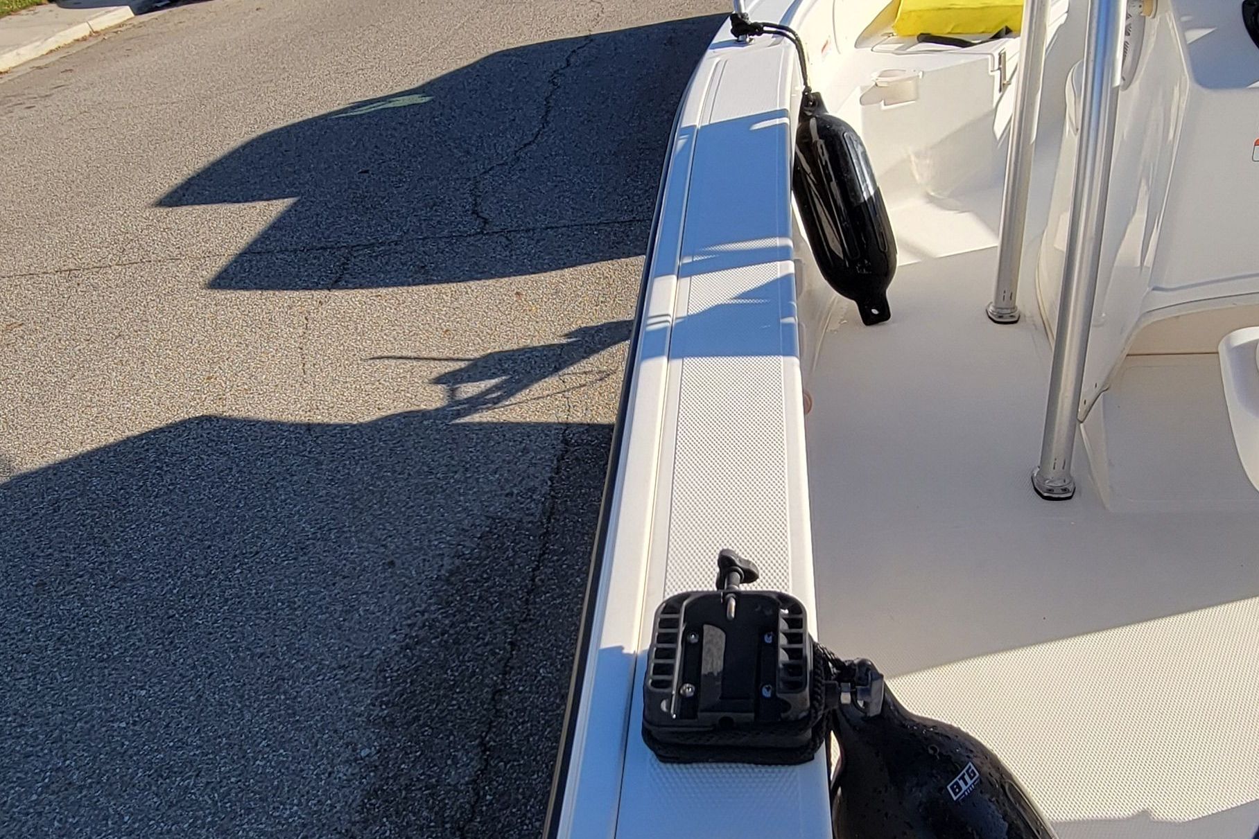 A 2017 Mako 184 Center Console boat on a trailer, showing clear details of the railing.